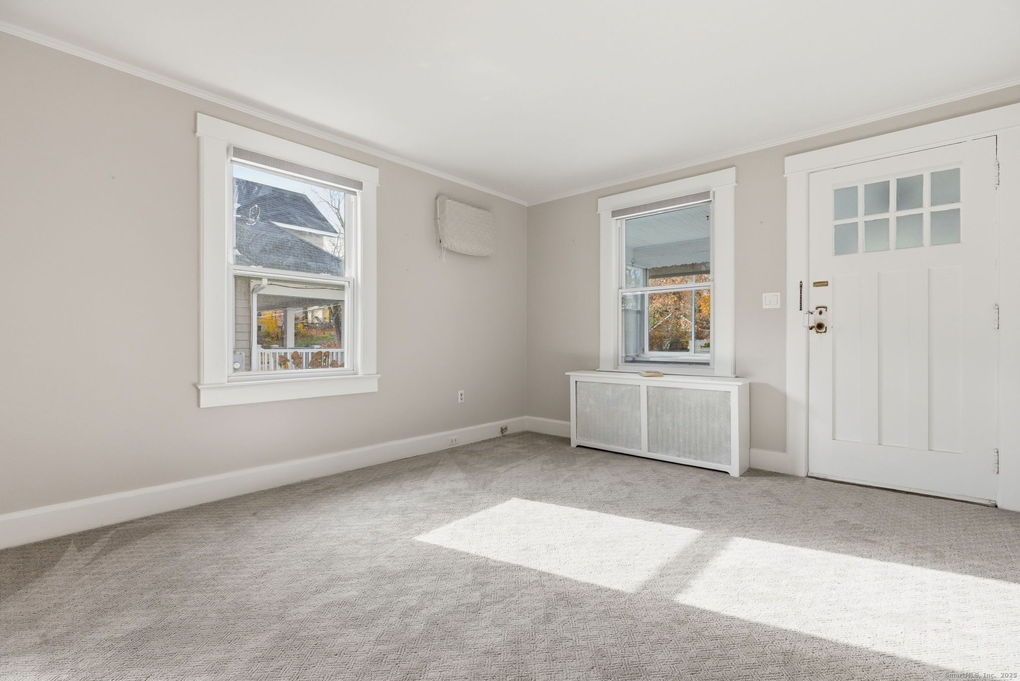 41 Sterling Place, Unit 1 Stamford, CT 06907 - Photo 4 of 29 an empty room with windows and cabinet