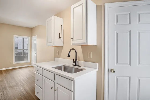 a kitchen with a stove and a refrigerator