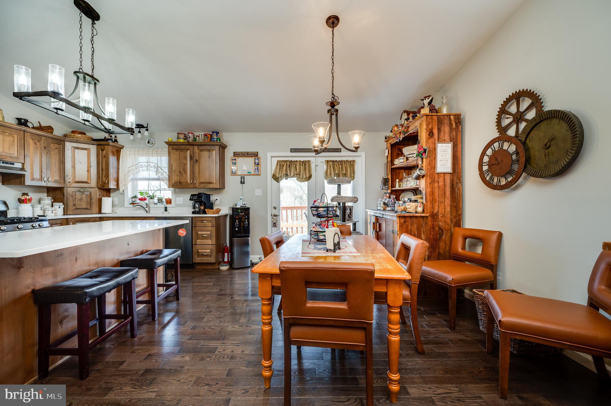 1133 Ashbourne Drive Reading, PA 19605 - Photo 12 of 64 a view of a dining room and livingroom with furniture wooden floor a chandelier