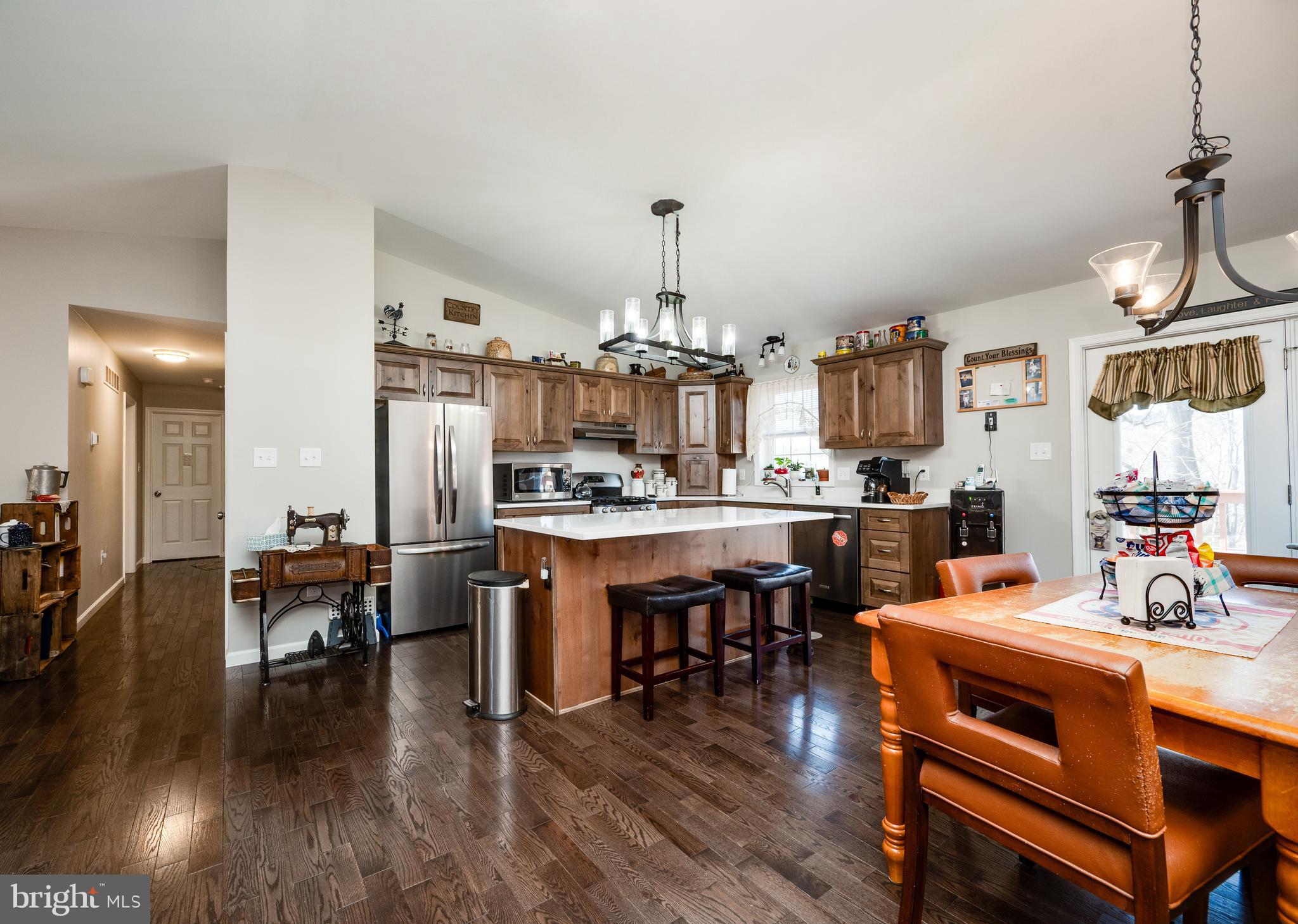 1133 Ashbourne Drive Reading, PA 19605 - Photo 13 of 64 a room with stainless steel appliances kitchen island granite countertop furniture a dining table and chairs