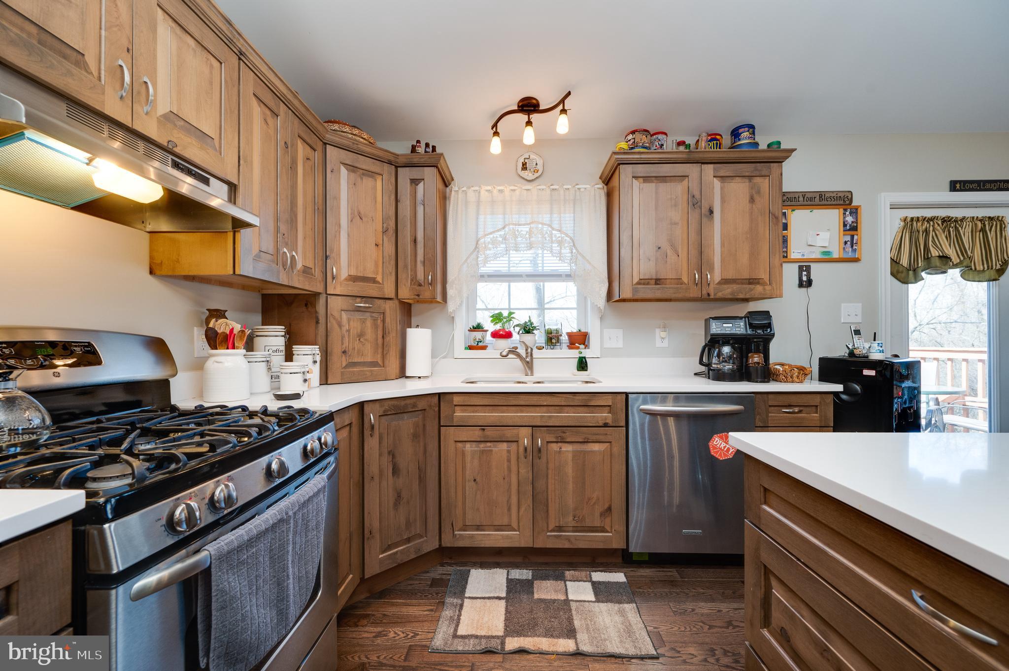 1133 Ashbourne Drive Reading, PA 19605 - Photo 17 of 64 a kitchen with stainless steel appliances a sink stove and cabinets