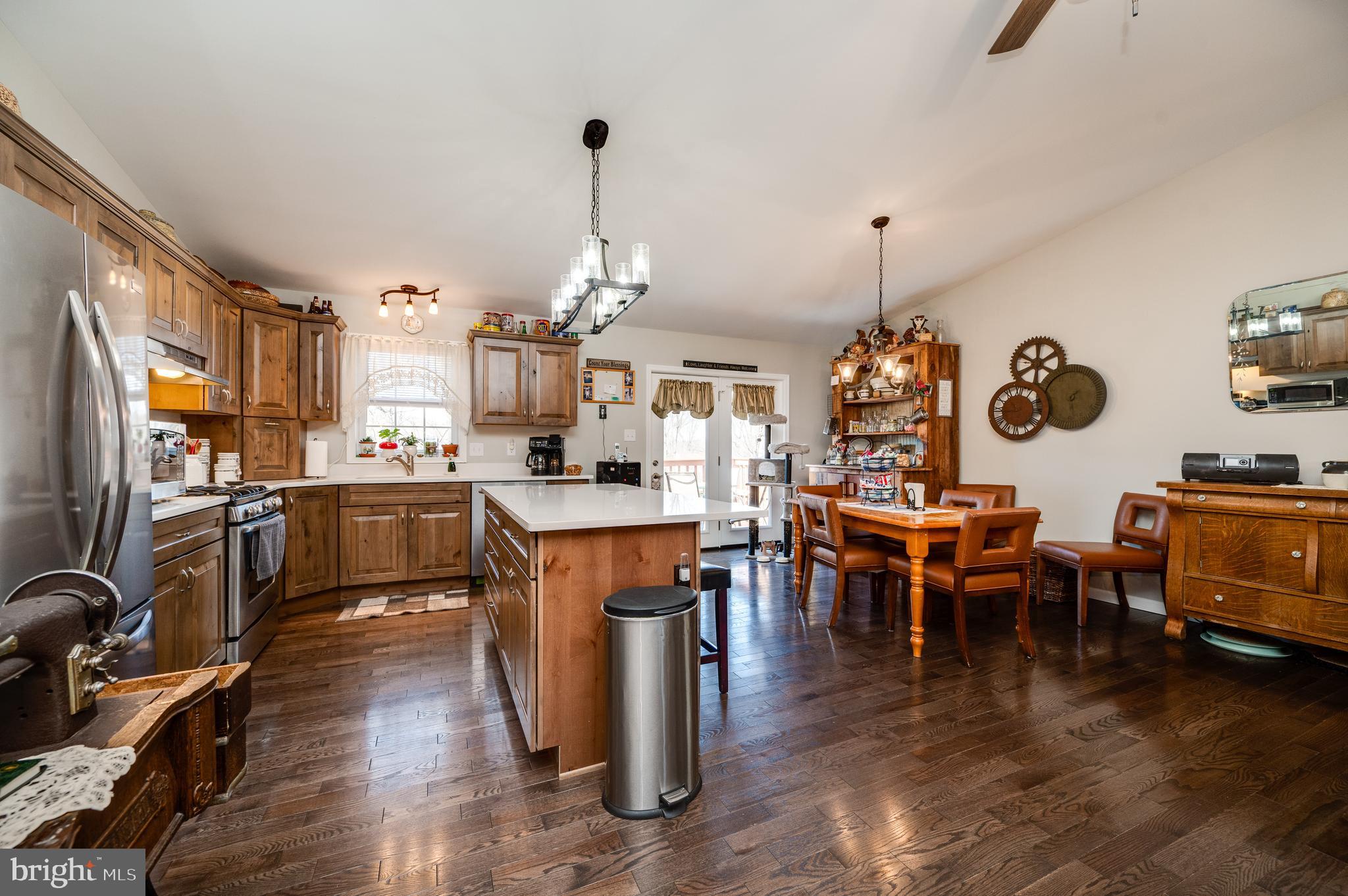 1133 Ashbourne Drive Reading, PA 19605 - Photo 24 of 64 a open kitchen view with stainless steel appliances refrigerator dining table and chairs