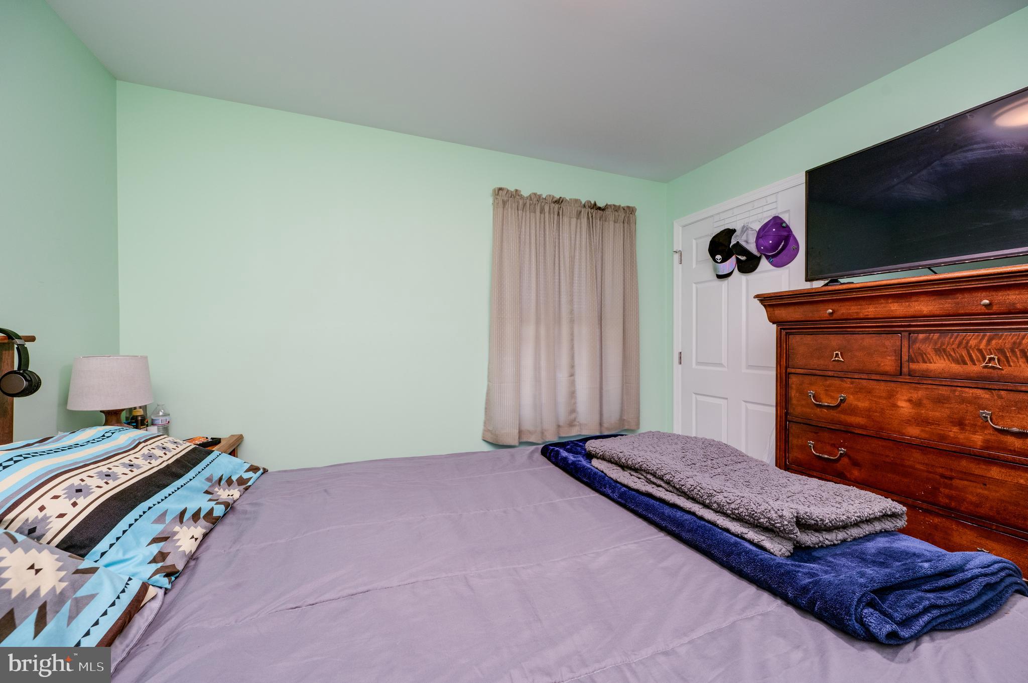 1133 Ashbourne Drive Reading, PA 19605 - Photo 28 of 64 a bedroom with a bed and a flat screen tv