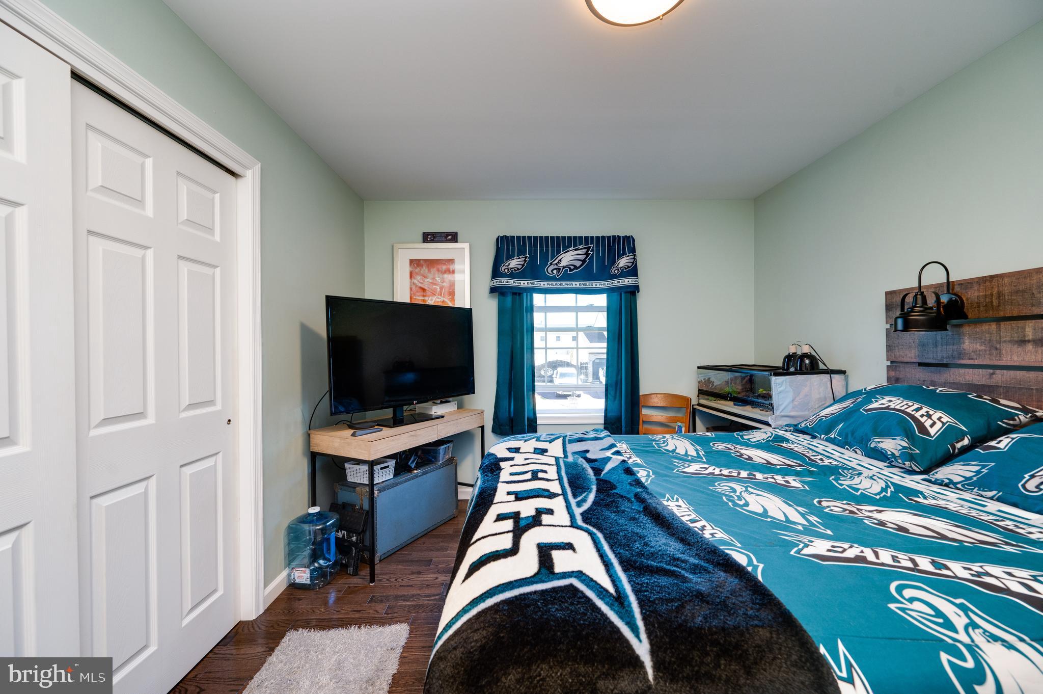 1133 Ashbourne Drive Reading, PA 19605 - Photo 31 of 64 a bedroom with a bed and a flat screen tv