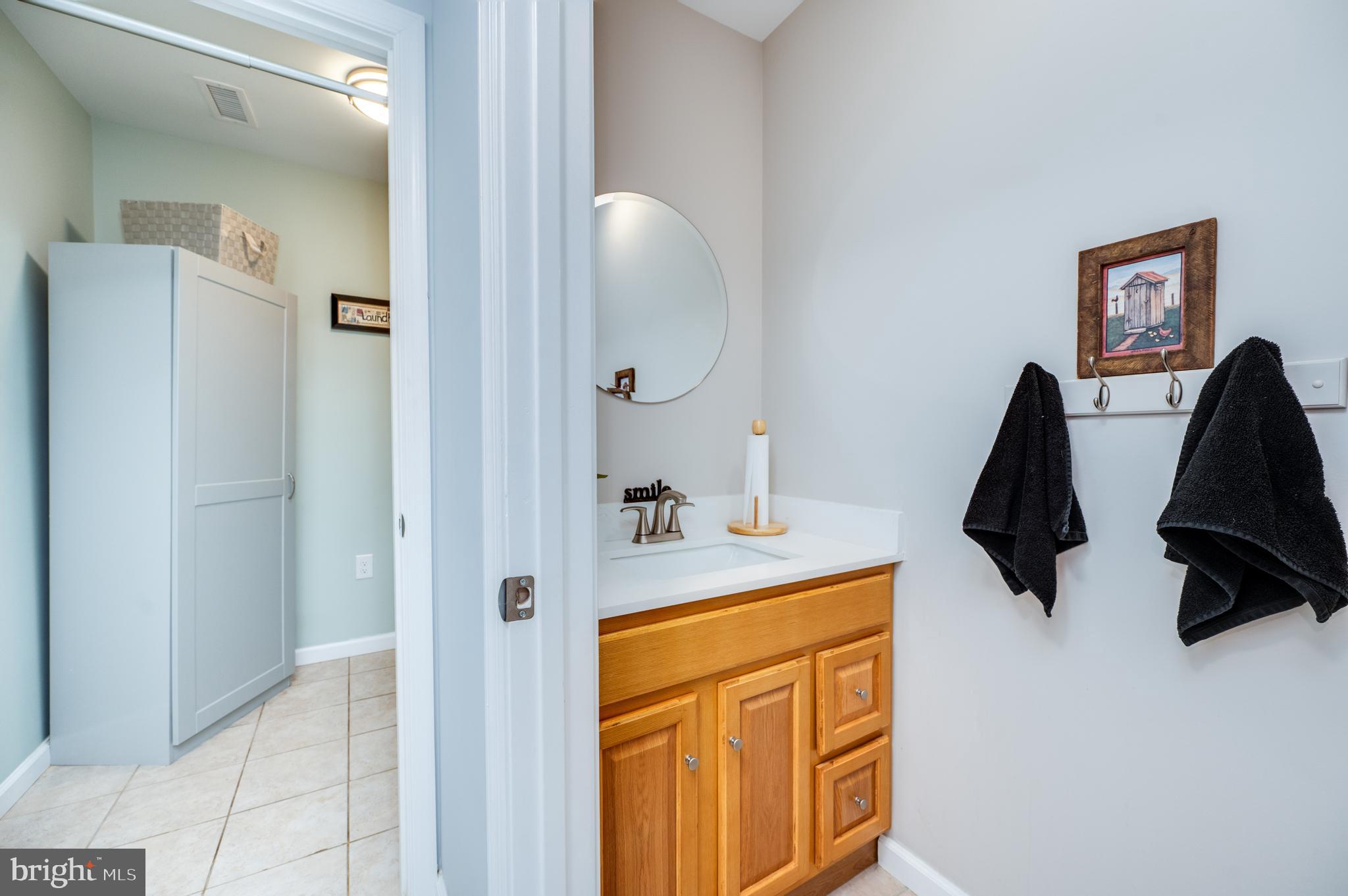 1133 Ashbourne Drive Reading, PA 19605 - Photo 45 of 64 a bathroom with a sink vanity and mirror