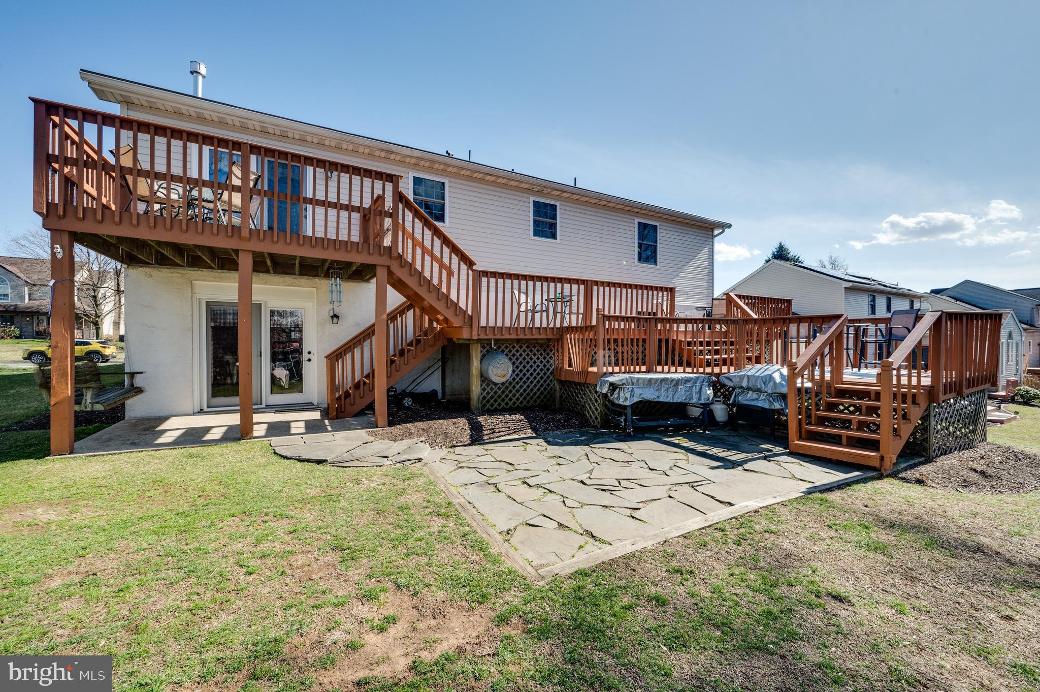 1133 Ashbourne Drive Reading, PA 19605 - Photo 54 of 64 a view of a house with a yard patio and wooden fence