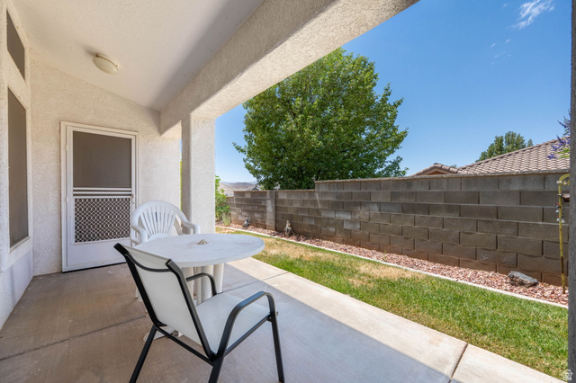 39 North Valley View Drive, Unit 51 St. George, UT 84770 - Photo 24 of 25 Covered patio with a concrete slab, exterior lighting, and a screen door