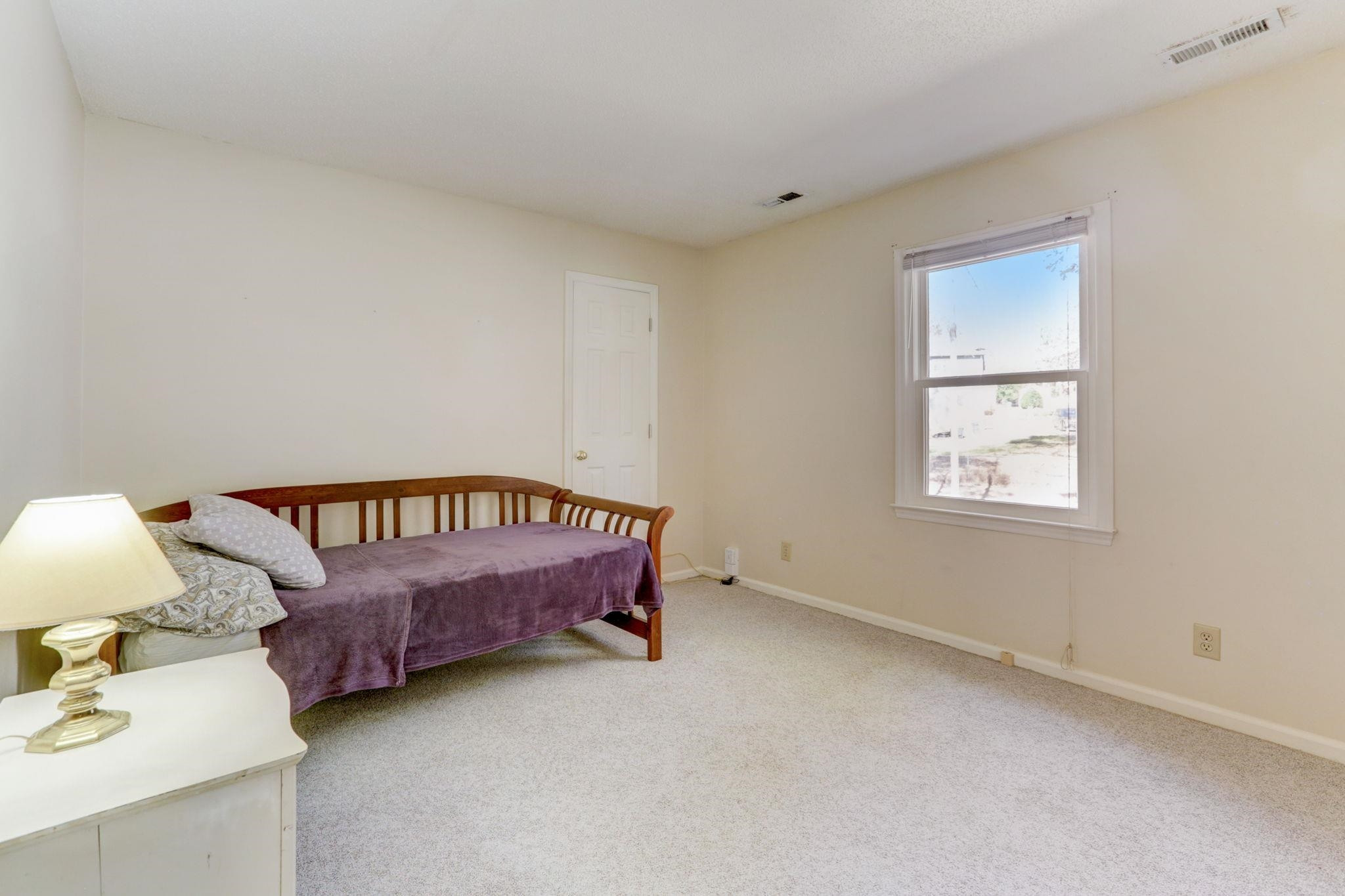 3 Danforth Place Durham, NC 27712 - Photo 20 of 38 a bed room with a bed and a chair