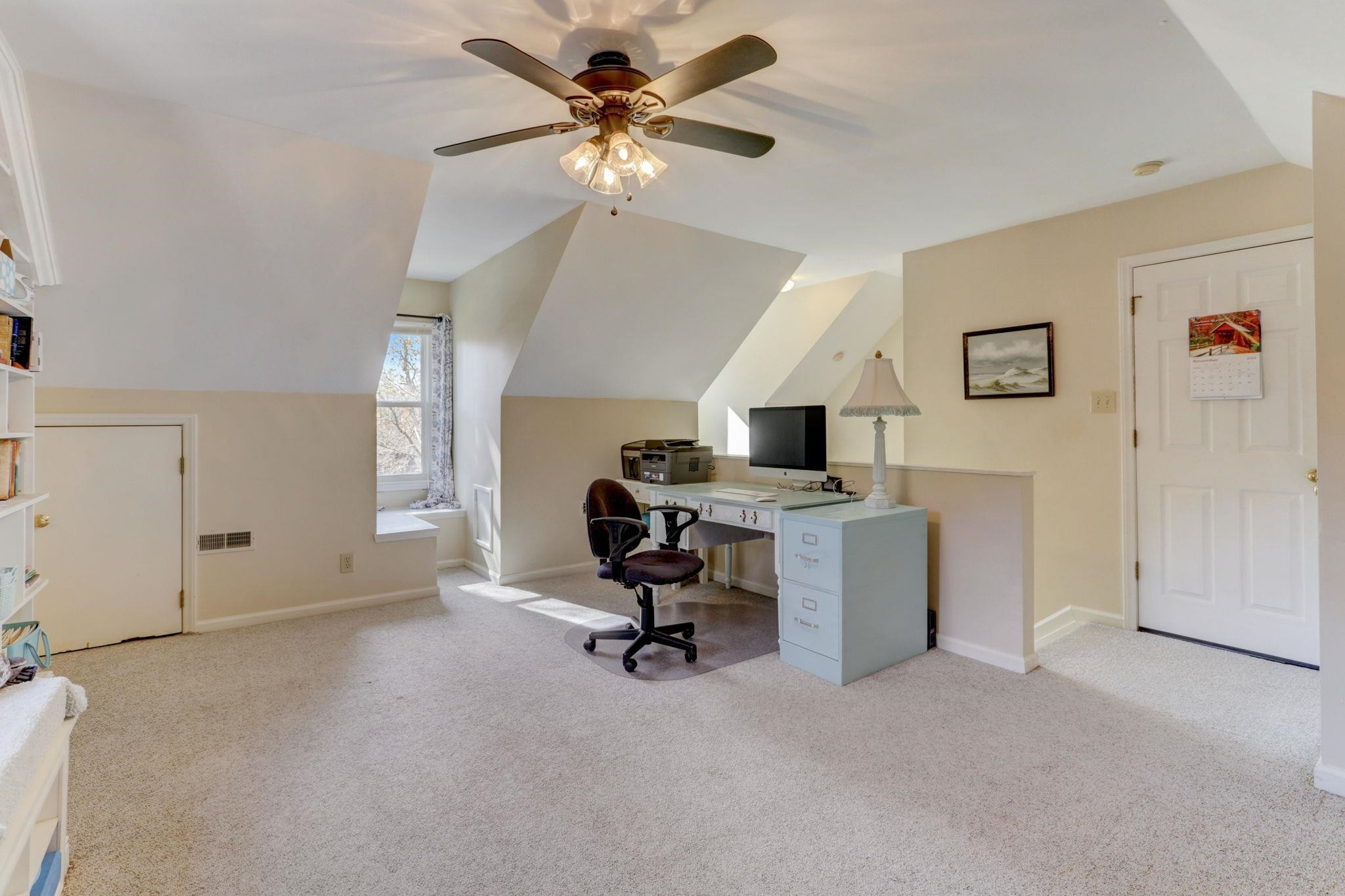 3 Danforth Place Durham, NC 27712 - Photo 31 of 38 a view of a workspace with furniture and a ceiling fan