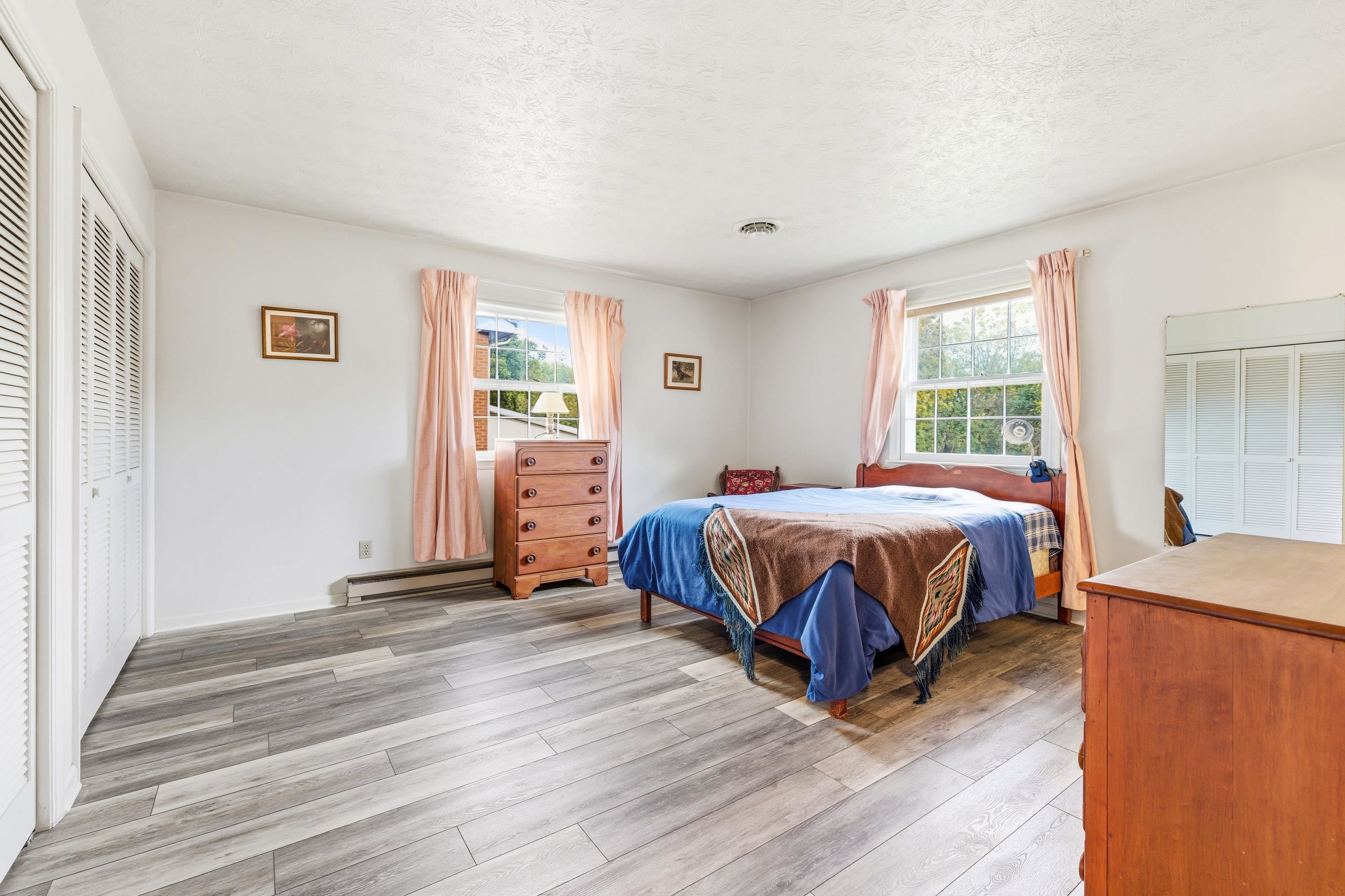 44 Emery Street Harrisonburg, VA 22801 - Photo 19 of 75 a spacious bedroom with a bed and wooden floor