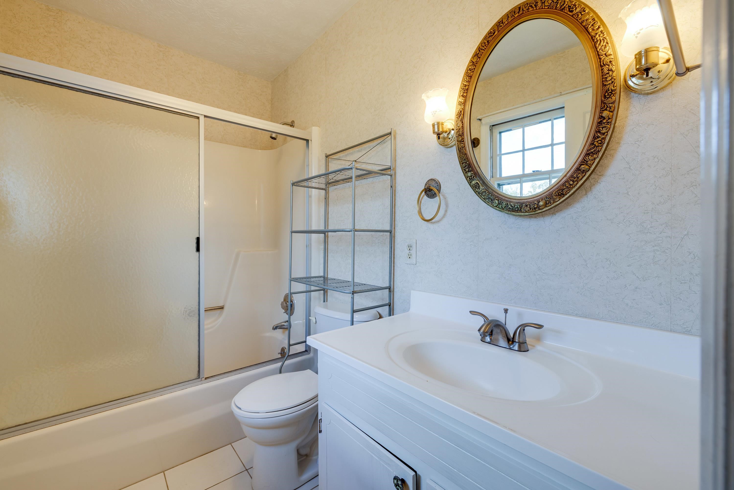 44 Emery Street Harrisonburg, VA 22801 - Photo 23 of 75 a bathroom with a sink a mirror a toilet and a shower