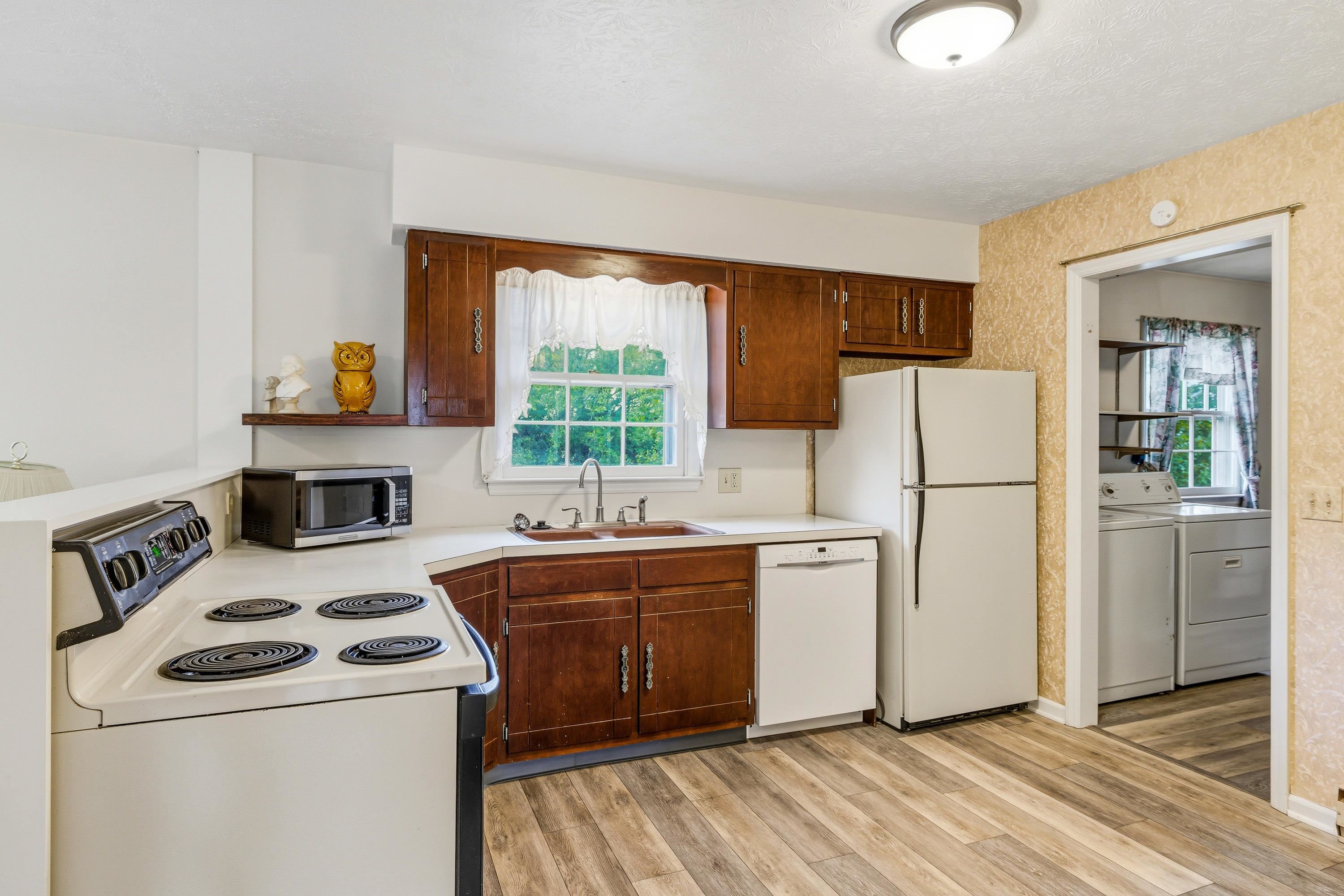44 Emery Street Harrisonburg, VA 22801 - Photo 3 of 75 a kitchen with a stove a refrigerator and a sink