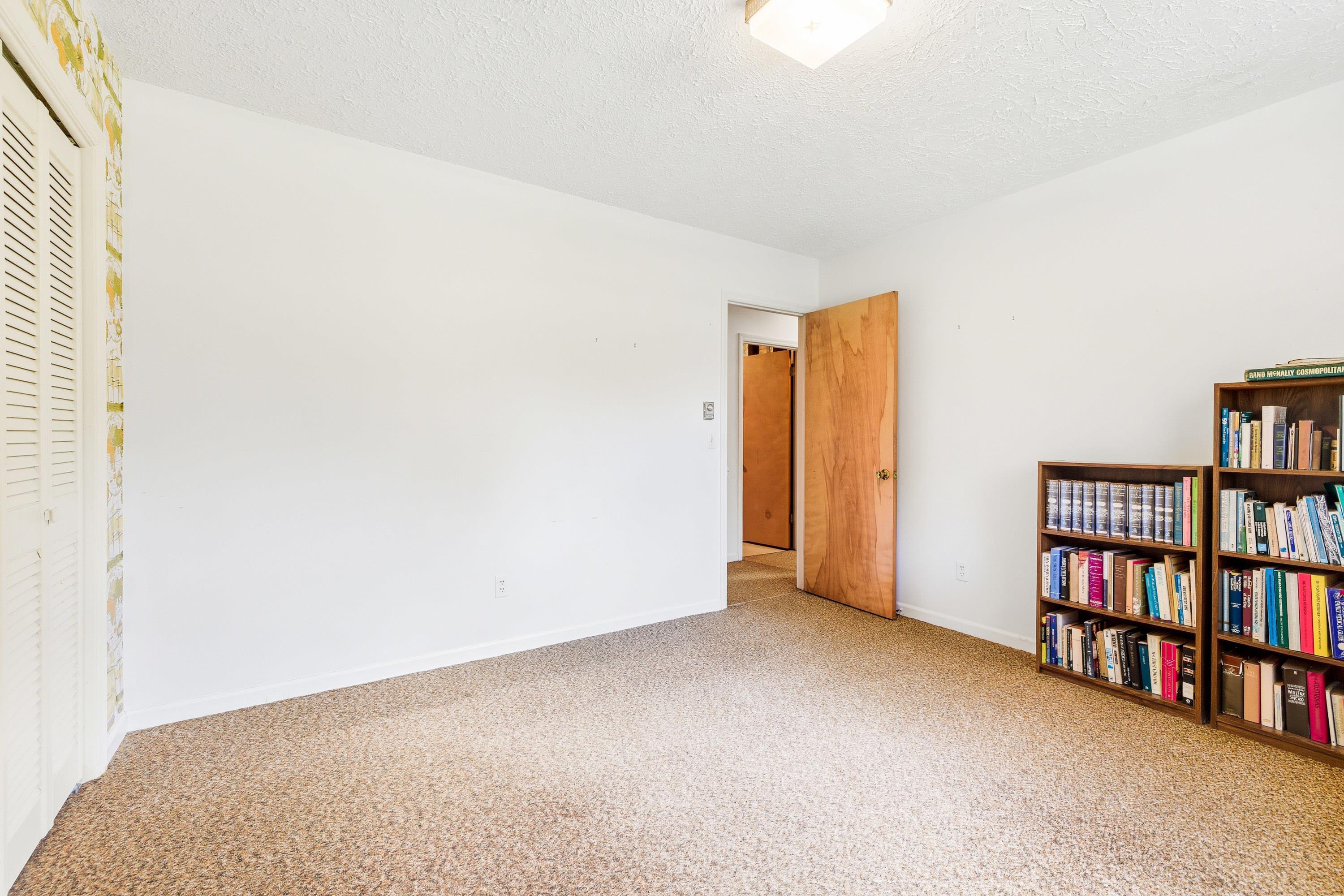 44 Emery Street Harrisonburg, VA 22801 - Photo 37 of 75 a view of an empty room with a book shelf