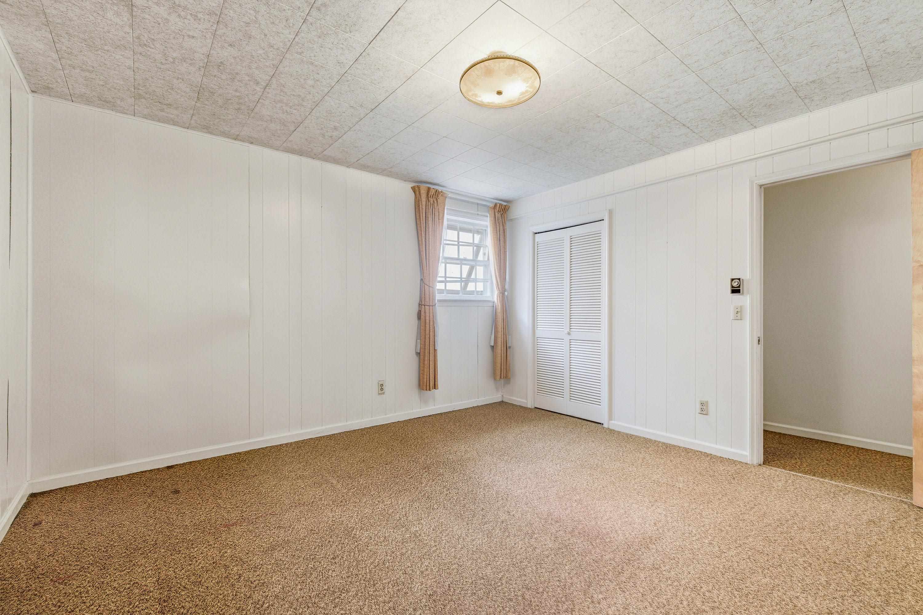 44 Emery Street Harrisonburg, VA 22801 - Photo 40 of 75 An additional large bedroom on the lower level of the home contains a window, very large closet for storage, and comfortable flooring throughout.
