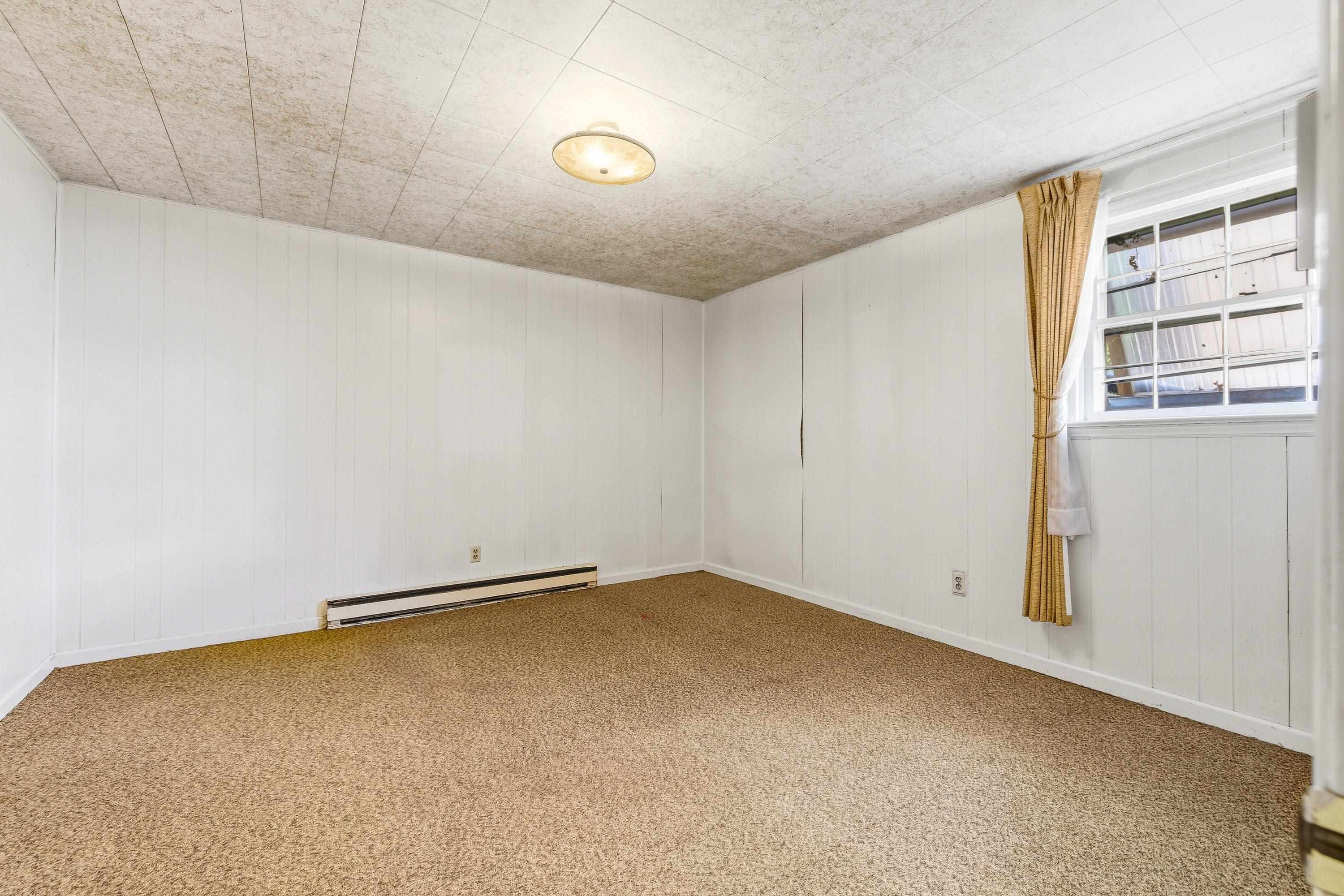 44 Emery Street Harrisonburg, VA 22801 - Photo 41 of 75 An additional large bedroom on the lower level of the home contains a window, very large closet for storage, and comfortable flooring throughout.