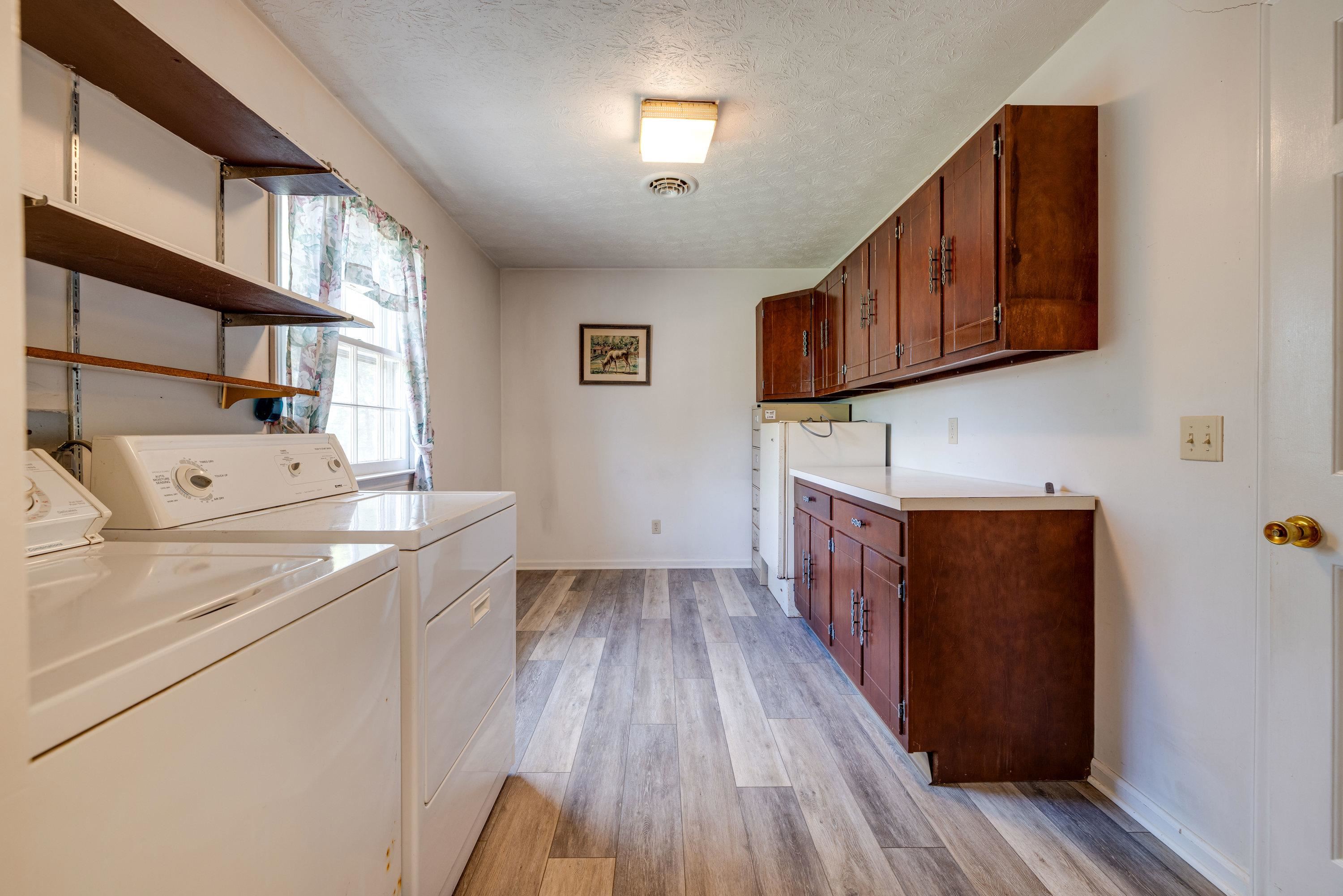 44 Emery Street Harrisonburg, VA 22801 - Photo 43 of 75 a view of hallway with wooden floor and cabinets