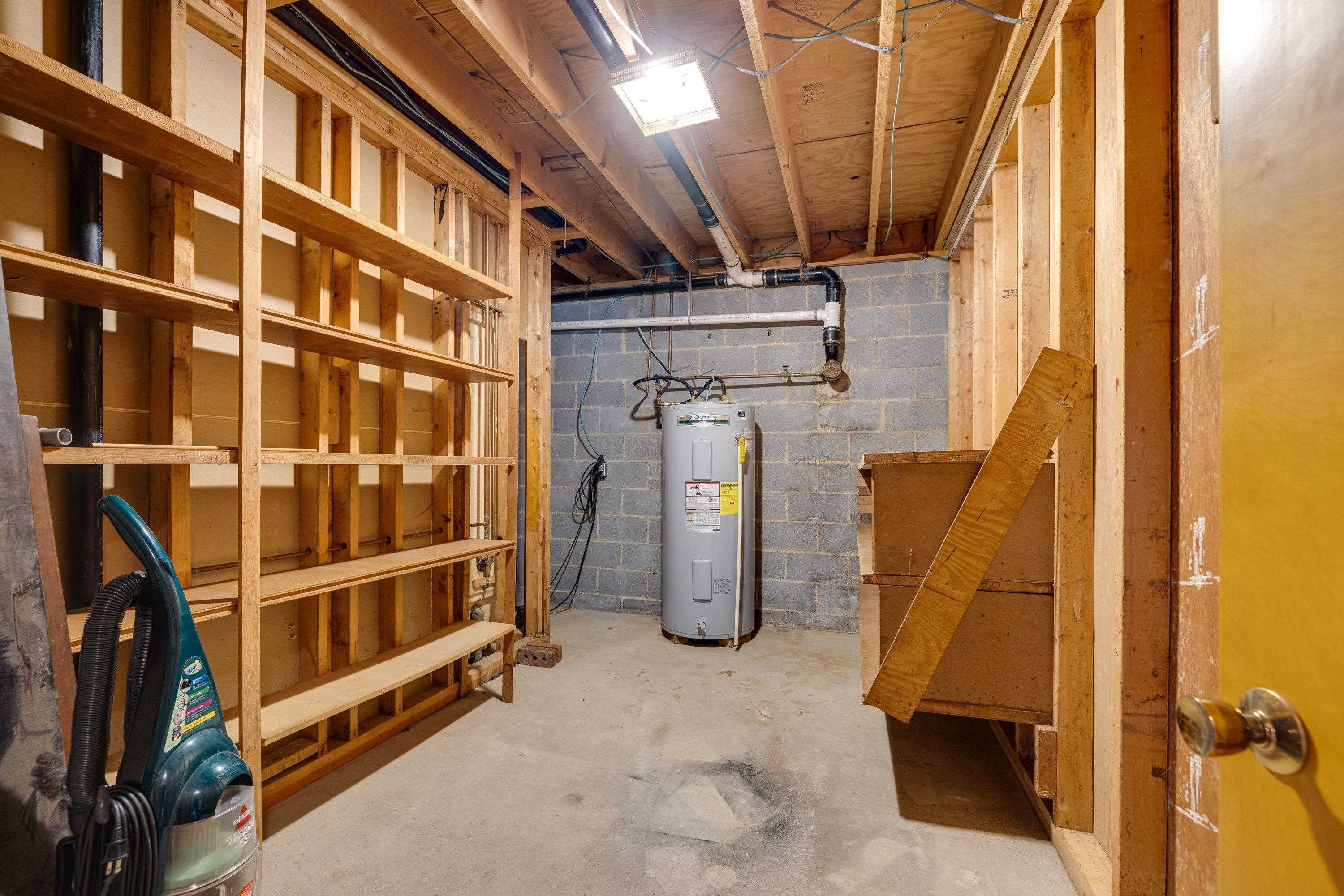 44 Emery Street Harrisonburg, VA 22801 - Photo 47 of 75 The utility room is located in the basement of the home and offers shelving for storage.
