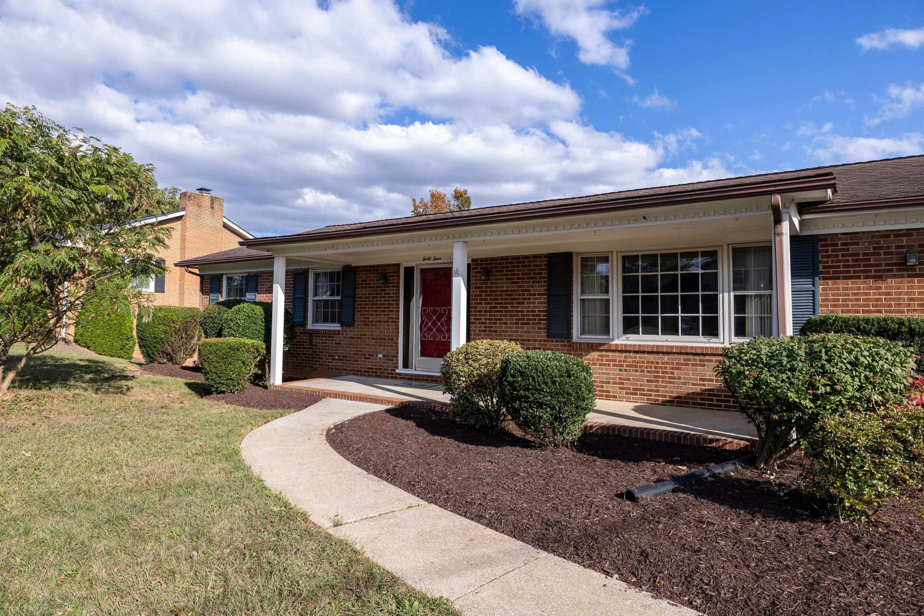 44 Emery Street Harrisonburg, VA 22801 - Photo 53 of 75 a front view of a house with a yard and outdoor seating