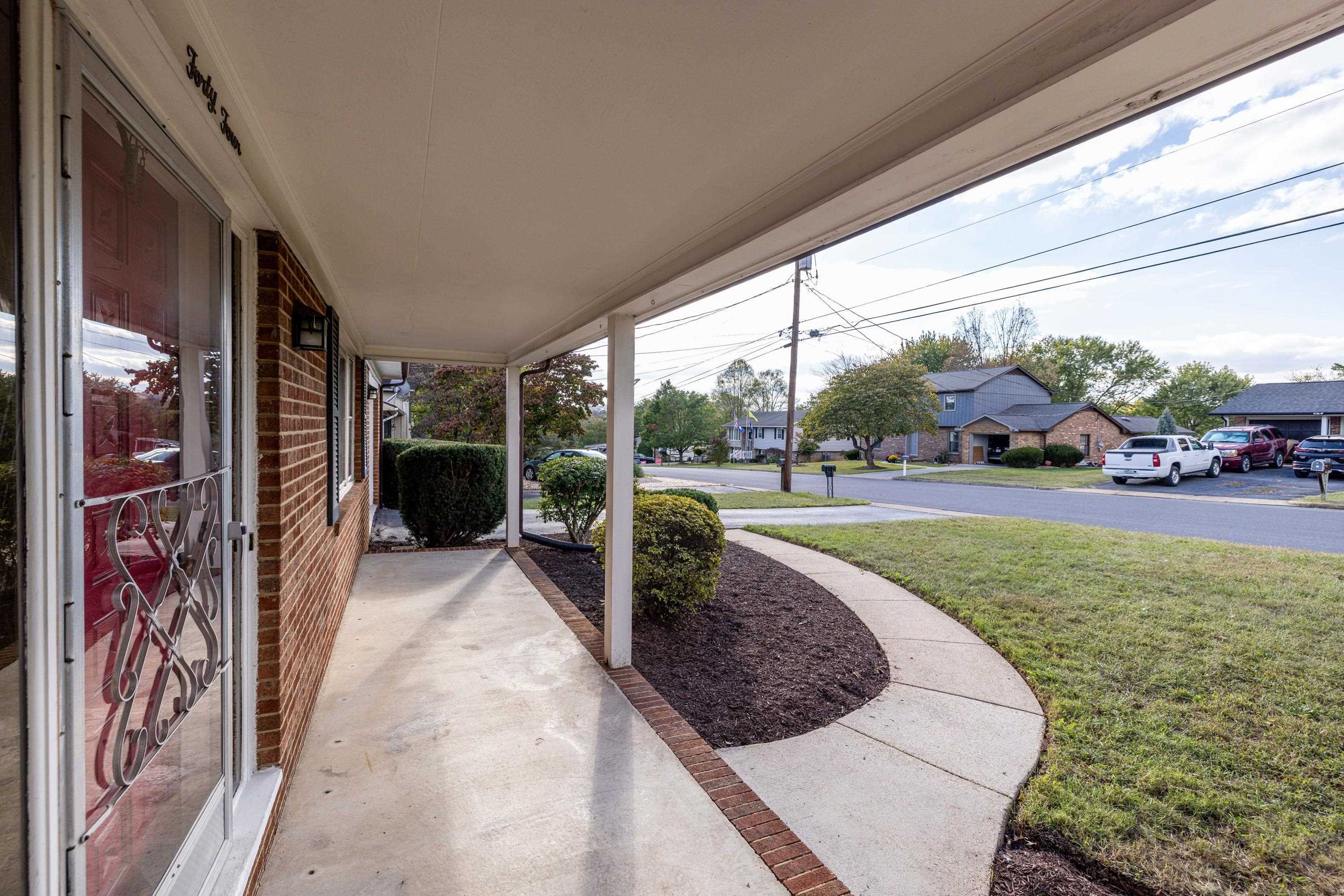 44 Emery Street Harrisonburg, VA 22801 - Photo 58 of 75 The large front porch is perfect for gathering with friends and family and overlooks the large front yard. The front porch also highlights the brick exterior of this home.