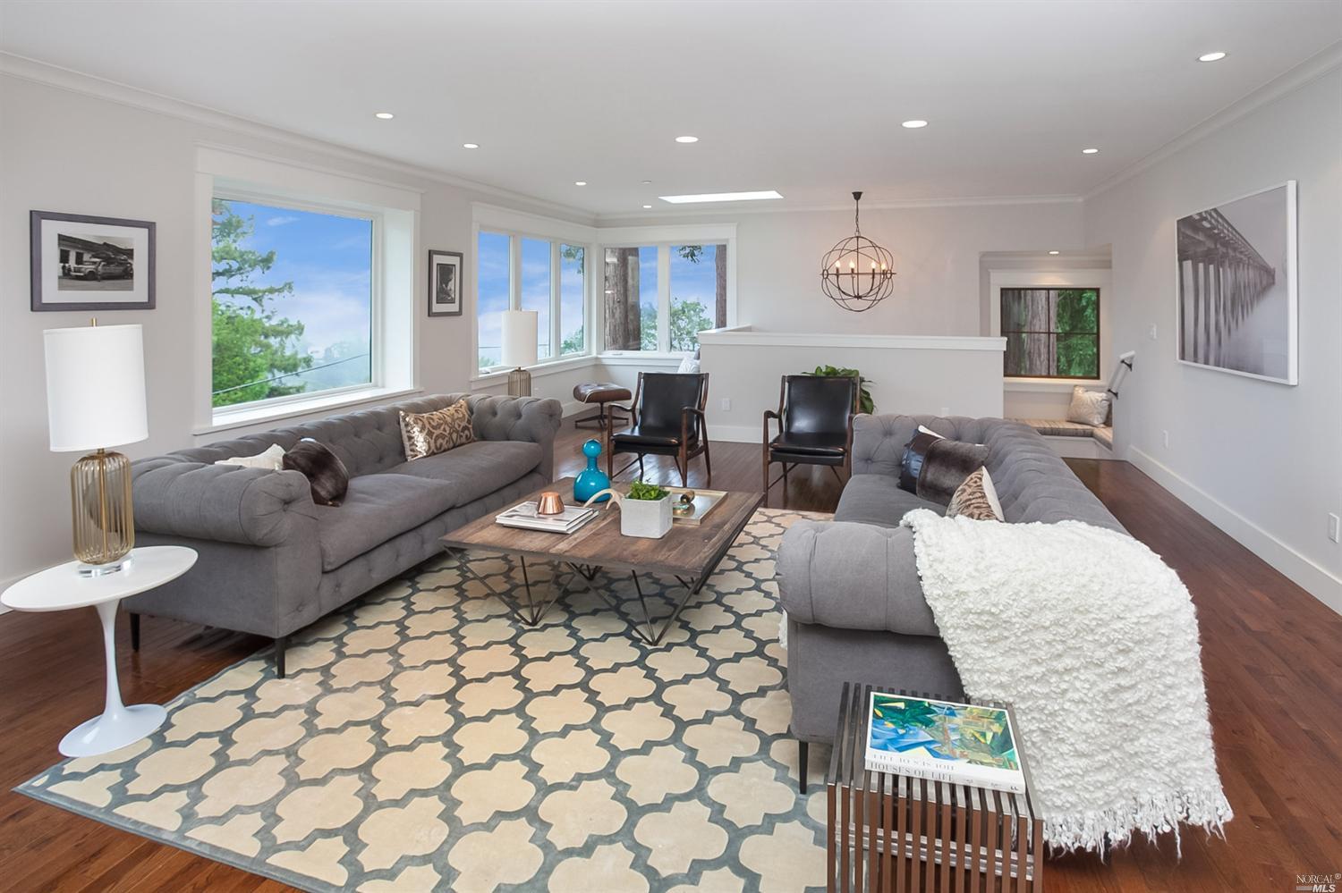 a living room with furniture and a table