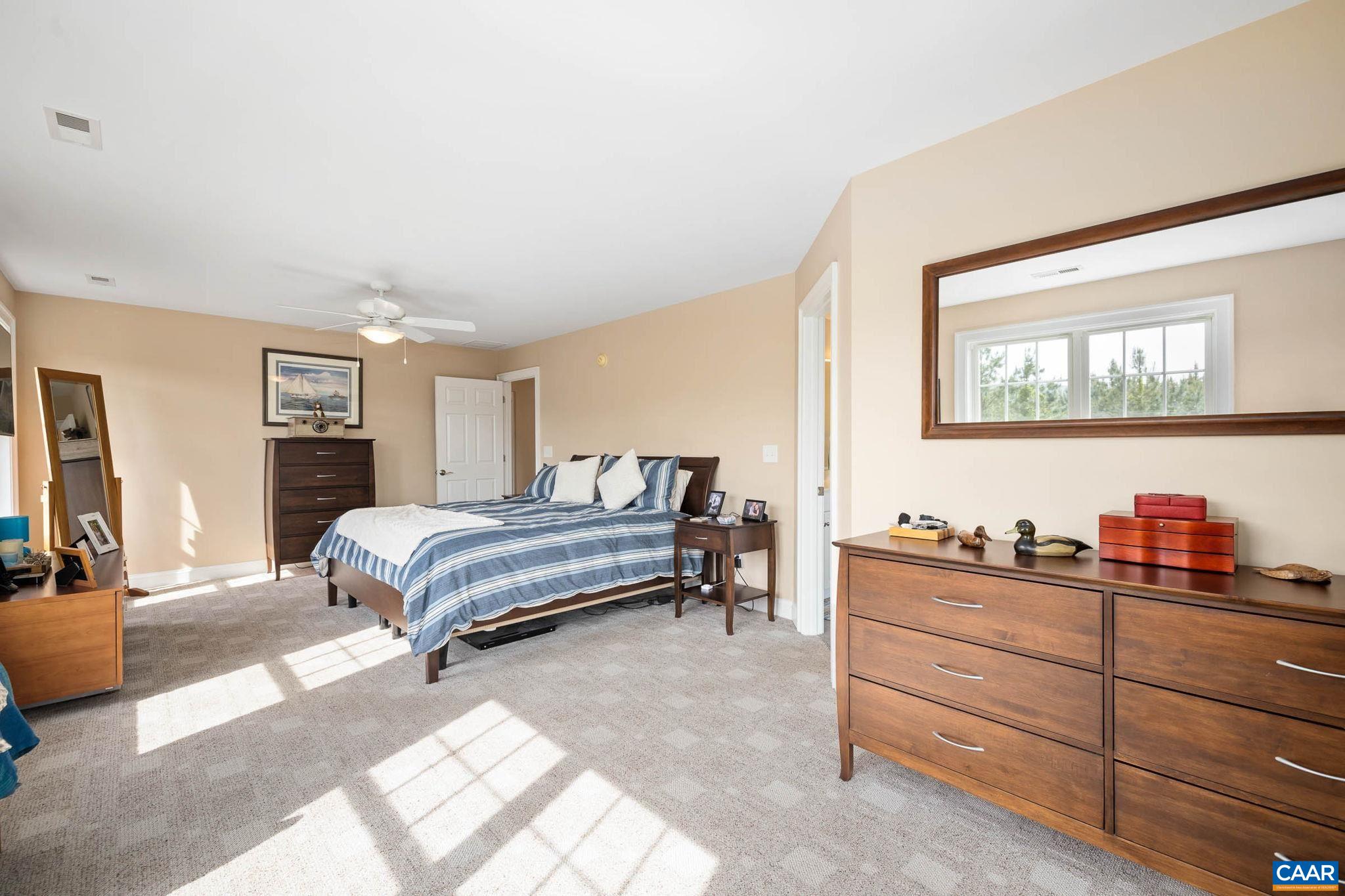 4271 Stony Point Road Keswick, VA 22947 - Photo 29 of 68 a bedroom with a bed and dresser
