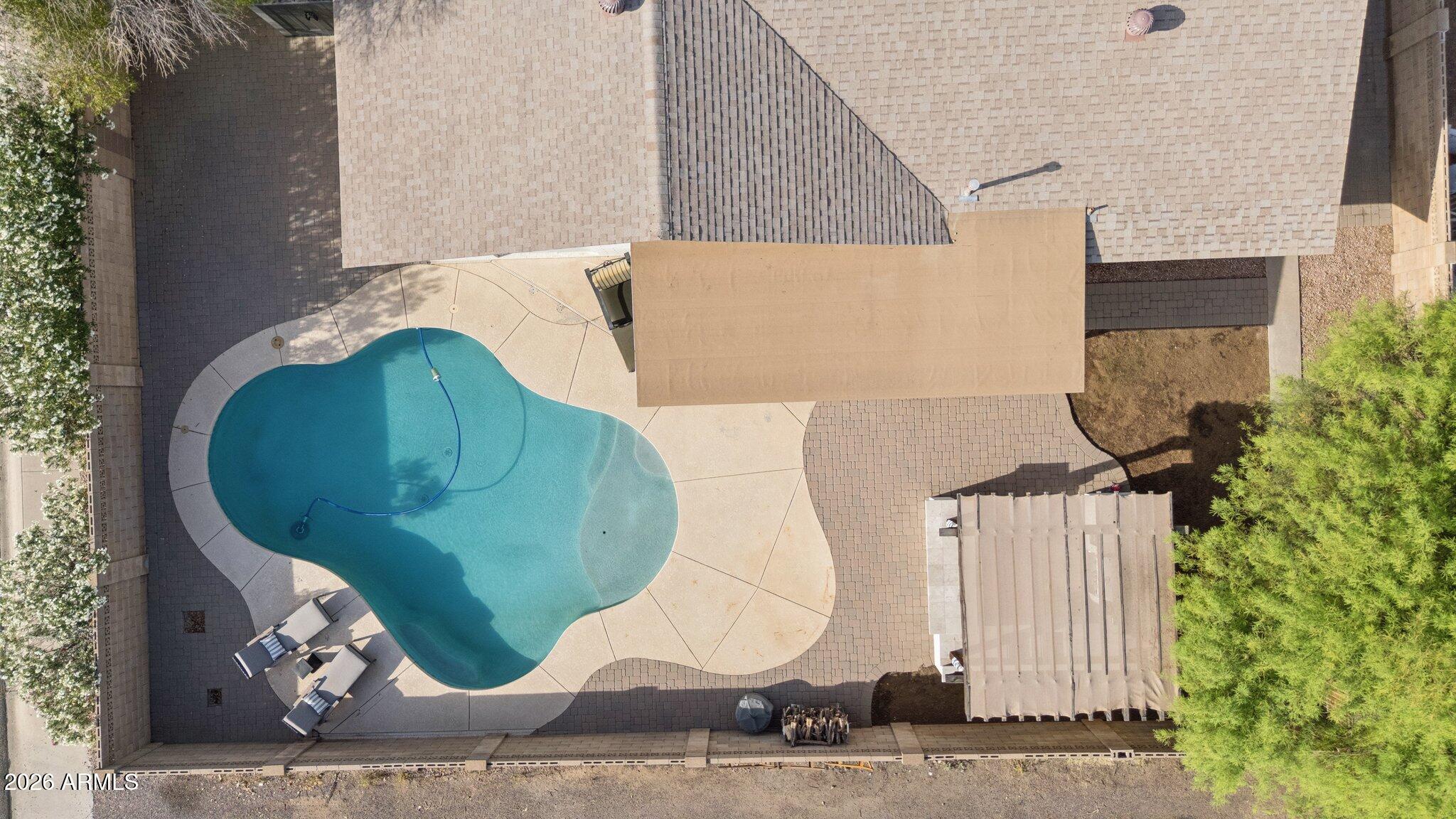 1715 West Orchid Lane Phoenix, AZ 85021 - Photo 43 of 57 an aerial view of a house with a swimming pool