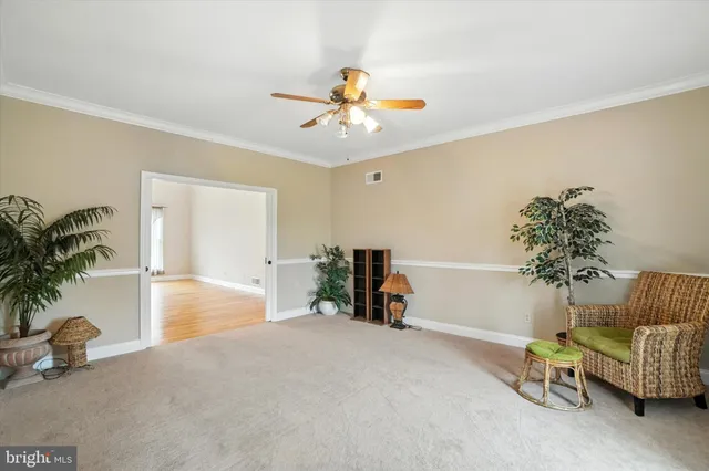 a view of a livingroom with furniture and a window