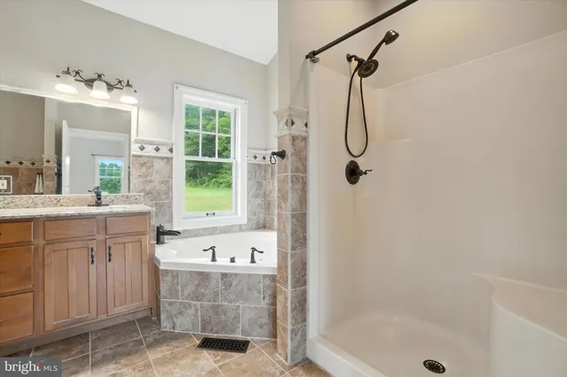 a dining room with furniture a chandelier and wooden floor