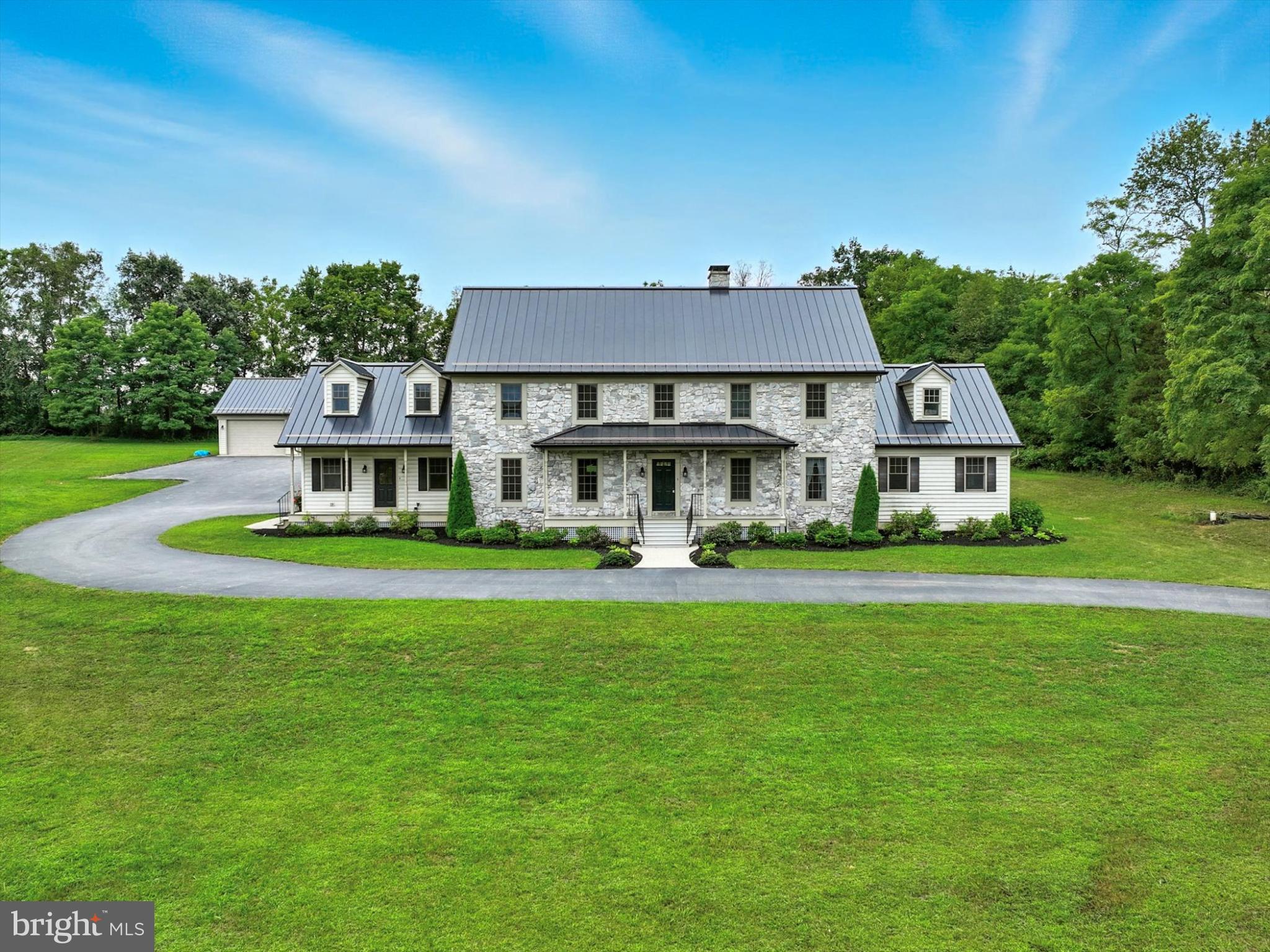 160 Vida Lane Dover, PA 17315 - Photo 2 of 61 a front view of a house with a garden