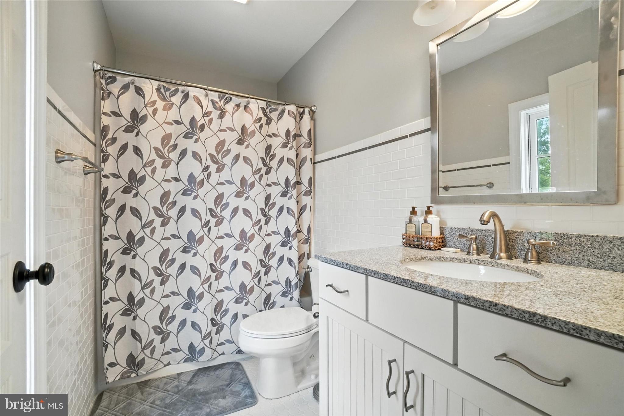 160 Vida Lane Dover, PA 17315 - Photo 33 of 61 a bathroom with a granite countertop sink a toilet and a mirror