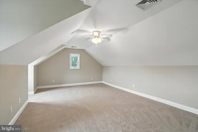 a view of an empty room with a balcony