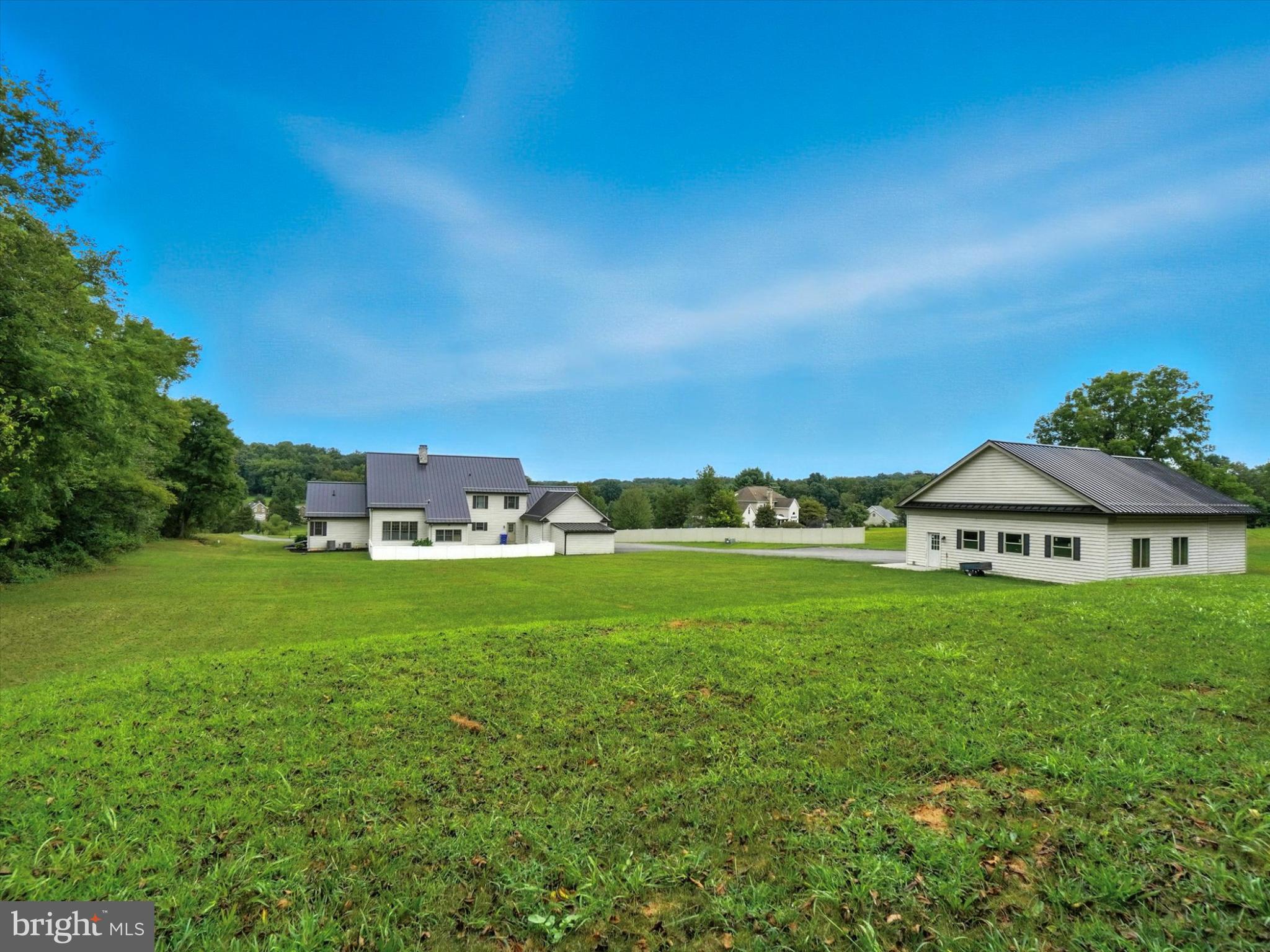 160 Vida Lane Dover, PA 17315 - Photo 49 of 61 a view of a green field with an house in the background