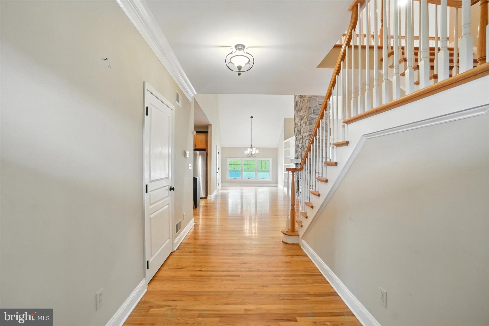 160 Vida Lane Dover, PA 17315 - Photo 5 of 61 a view of a hallway with wooden floor and staircase
