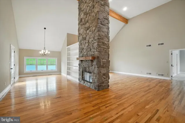 a living room with fireplace furniture and a flat screen tv