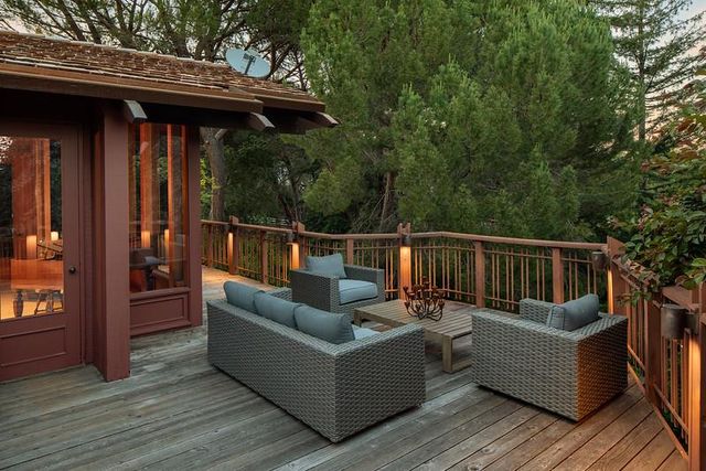 a view of sitting area with furniture and wooden deck