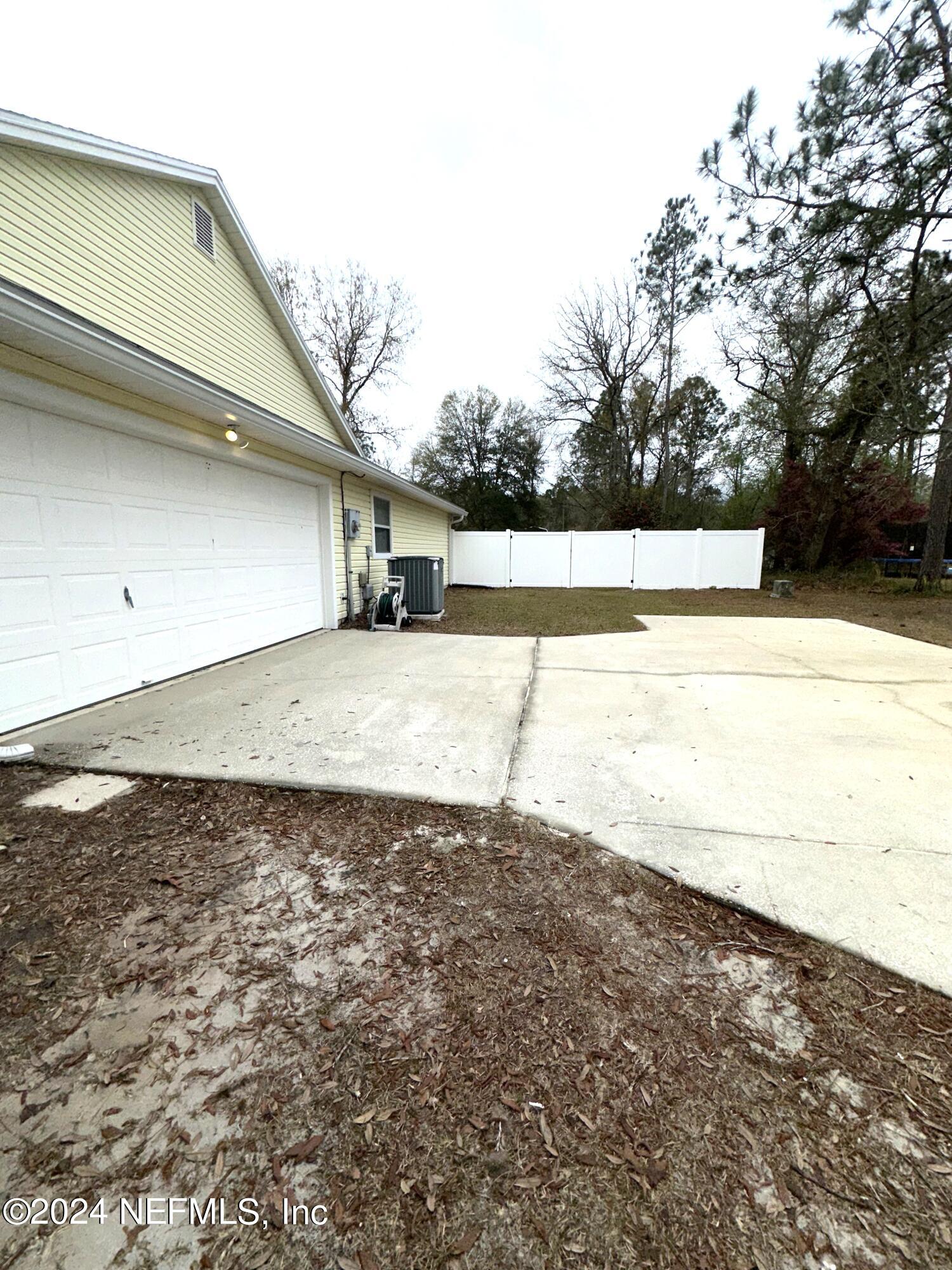 10339 Ford Road Bryceville, FL 32009 - Photo 6 of 41 Garage Side Gate Entry