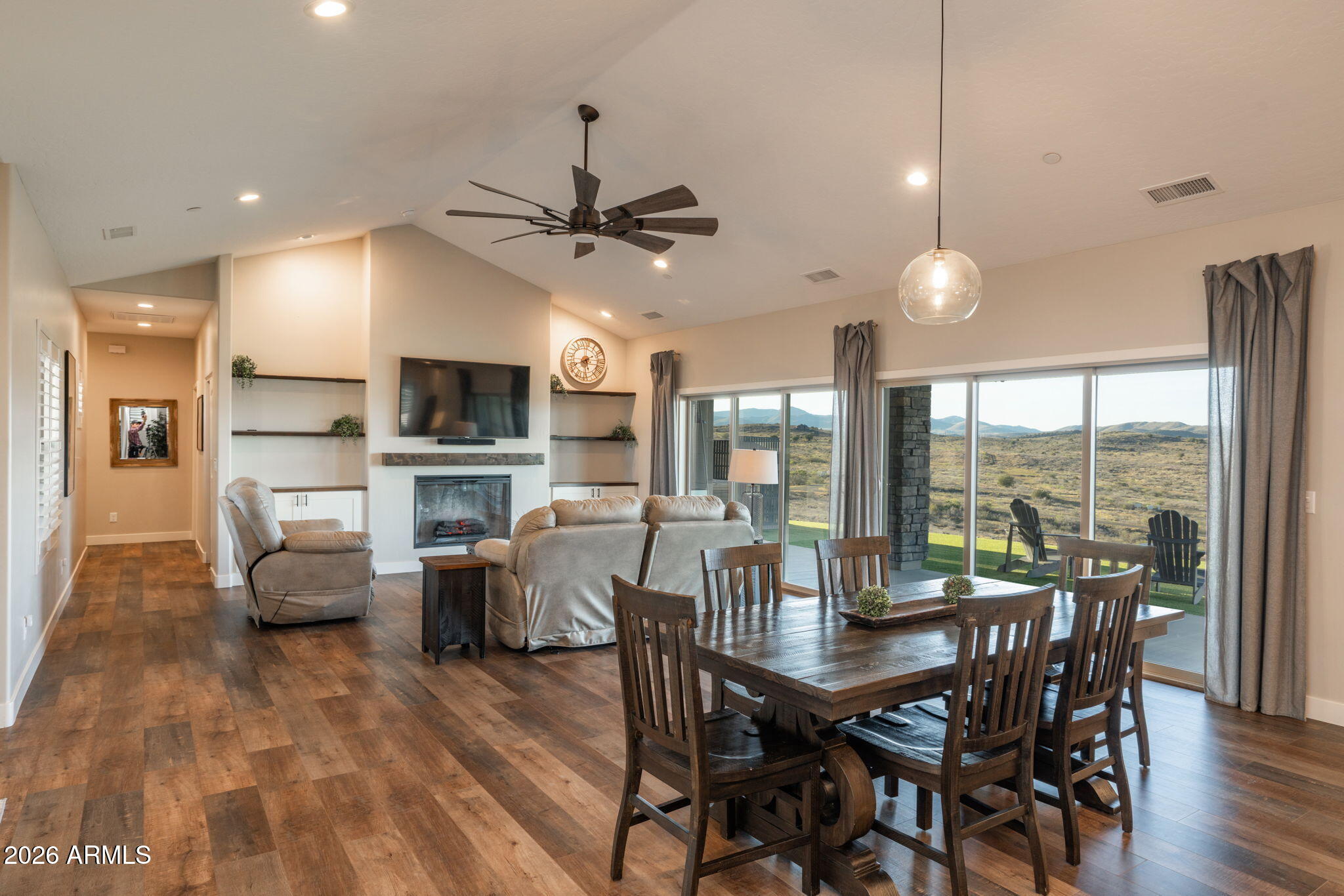 15140 East Countryside Road Mayer, AZ 86333 - Photo 12 of 67 a view of a dining room with furniture window and wooden floor