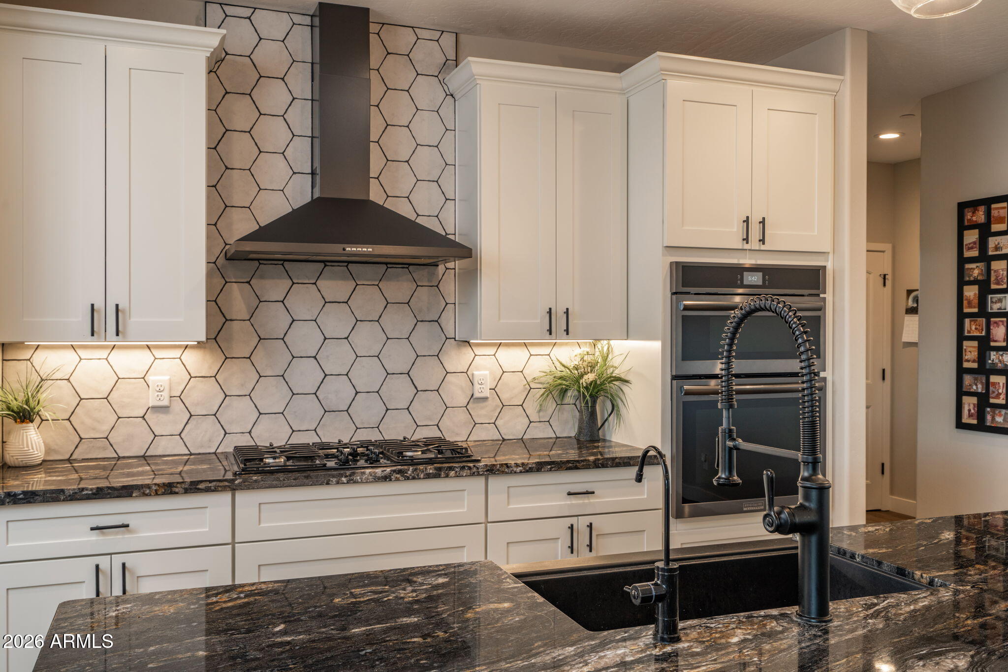 15140 East Countryside Road Mayer, AZ 86333 - Photo 18 of 67 a kitchen with a stove and a refrigerator