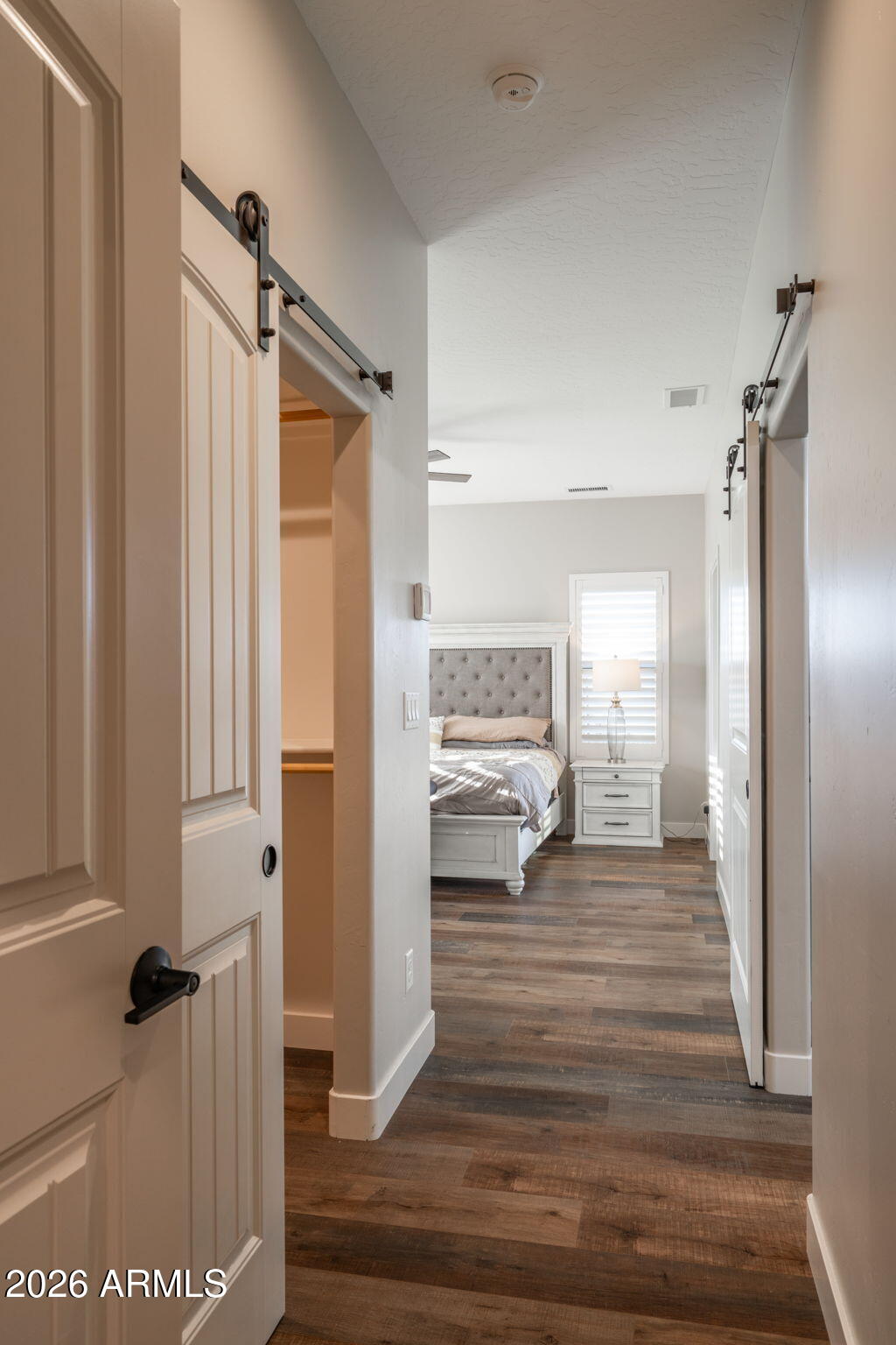 15140 East Countryside Road Mayer, AZ 86333 - Photo 25 of 67 a view of a hallway with wooden floor and staircase