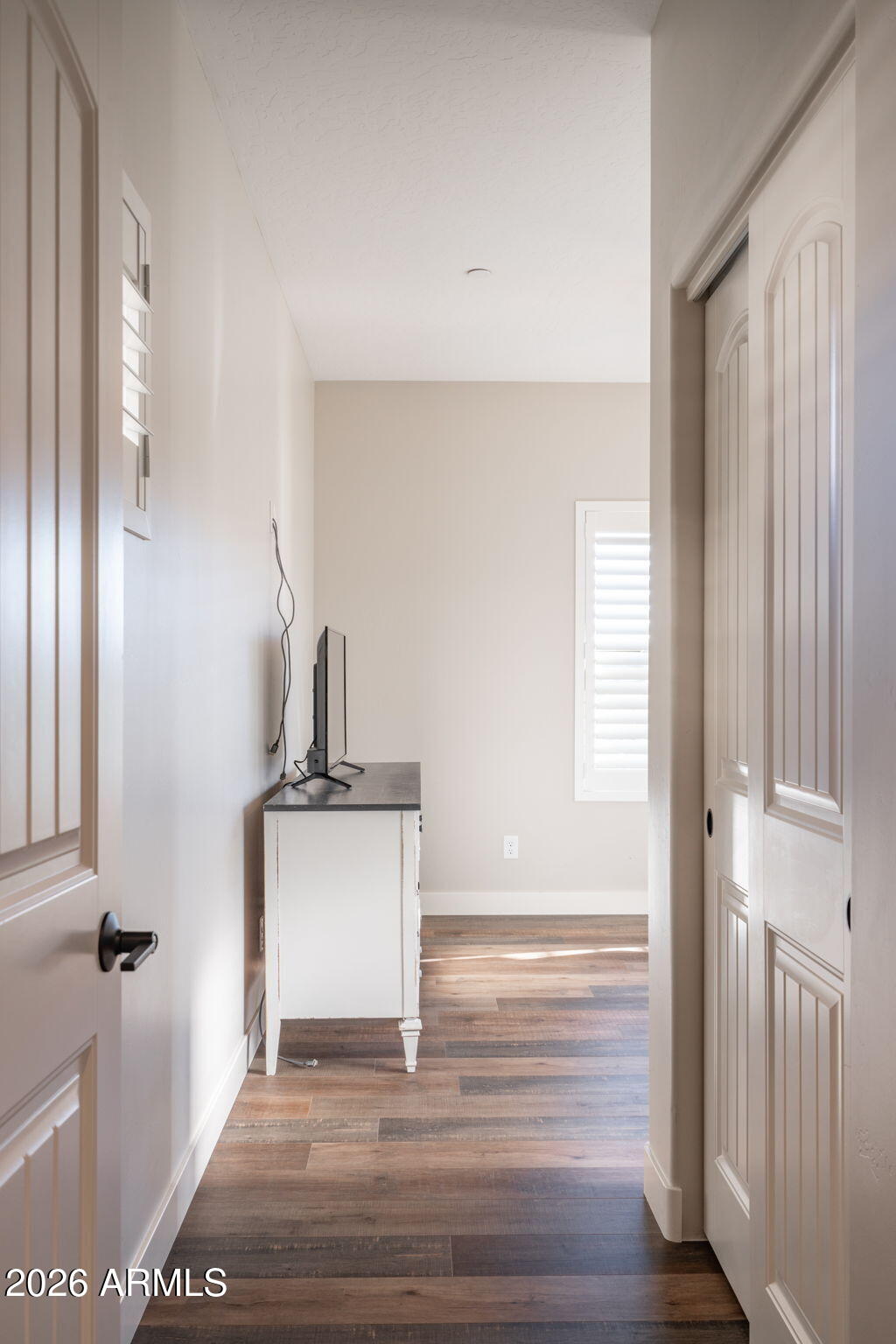 15140 East Countryside Road Mayer, AZ 86333 - Photo 26 of 67 a view of a hallway with wooden floor and staircase