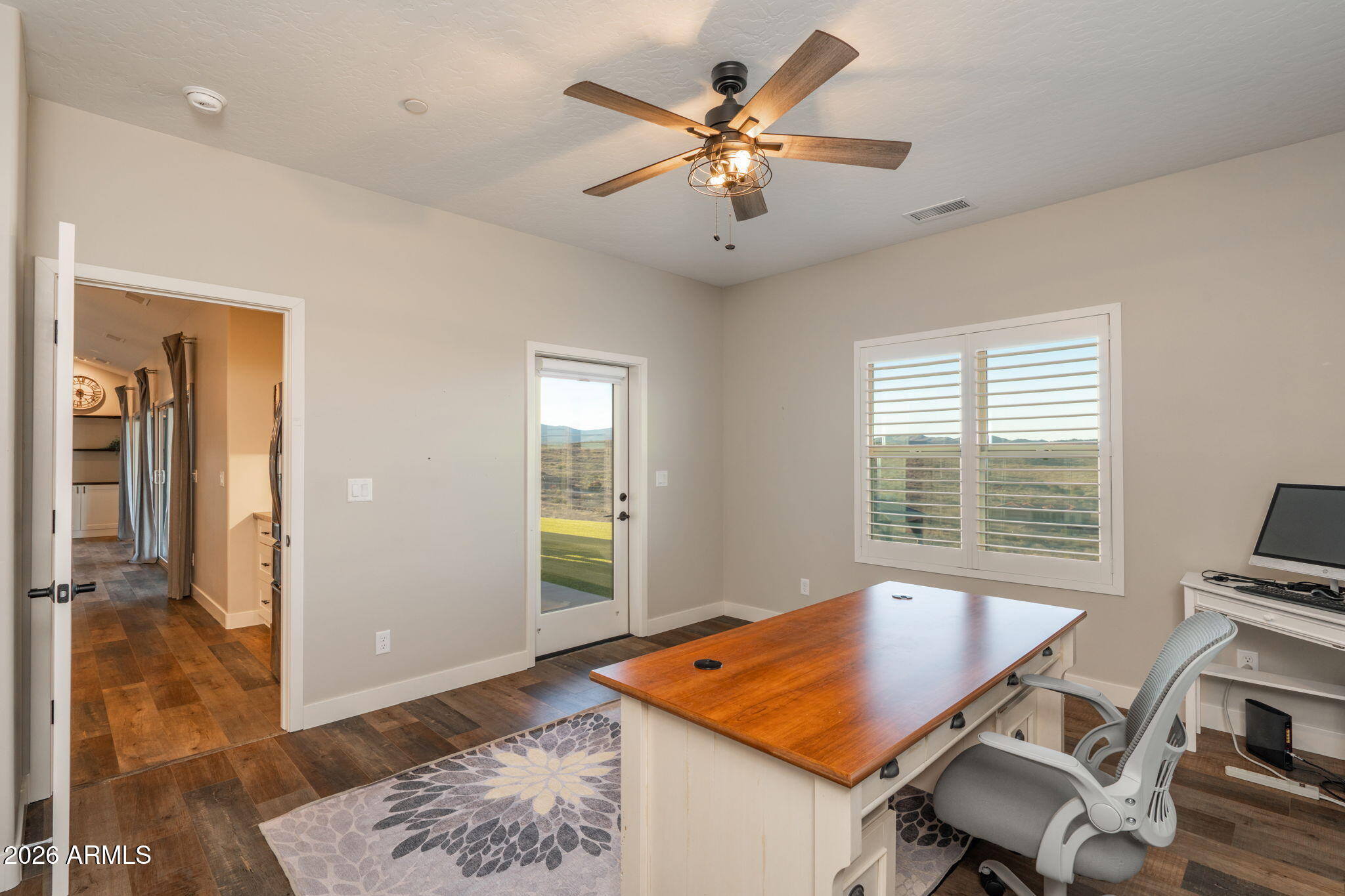 15140 East Countryside Road Mayer, AZ 86333 - Photo 32 of 67 a view of a workspace with furniture and a window