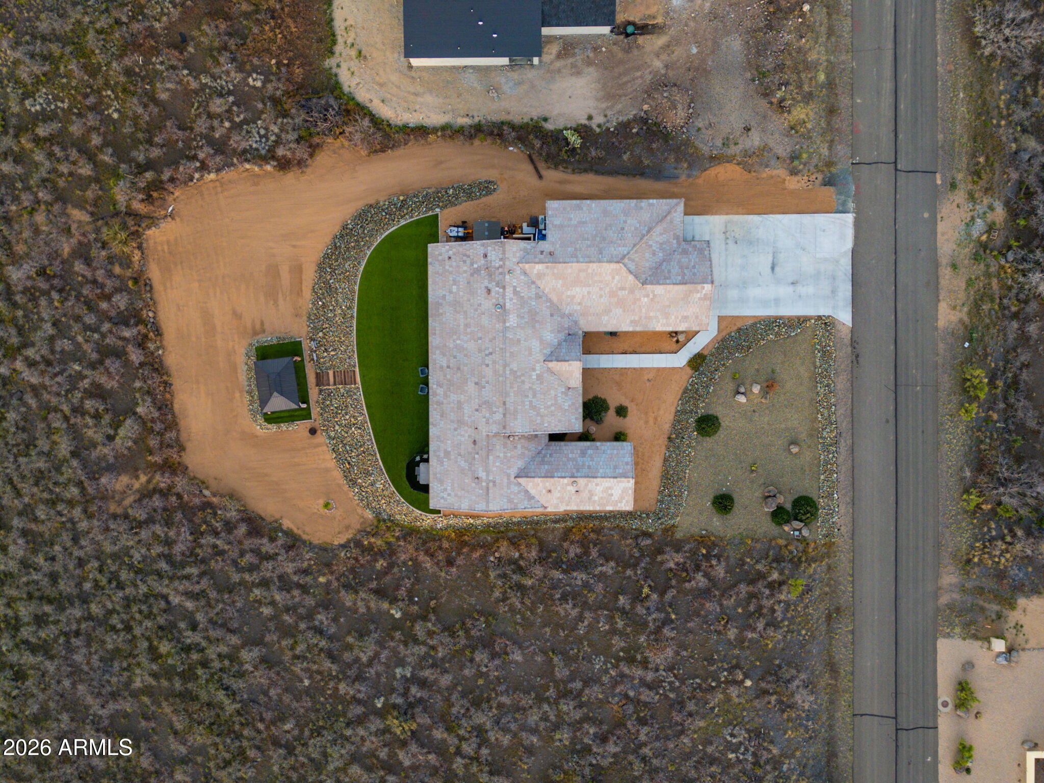 15140 East Countryside Road Mayer, AZ 86333 - Photo 35 of 67 an aerial view of a house with a swimming pool