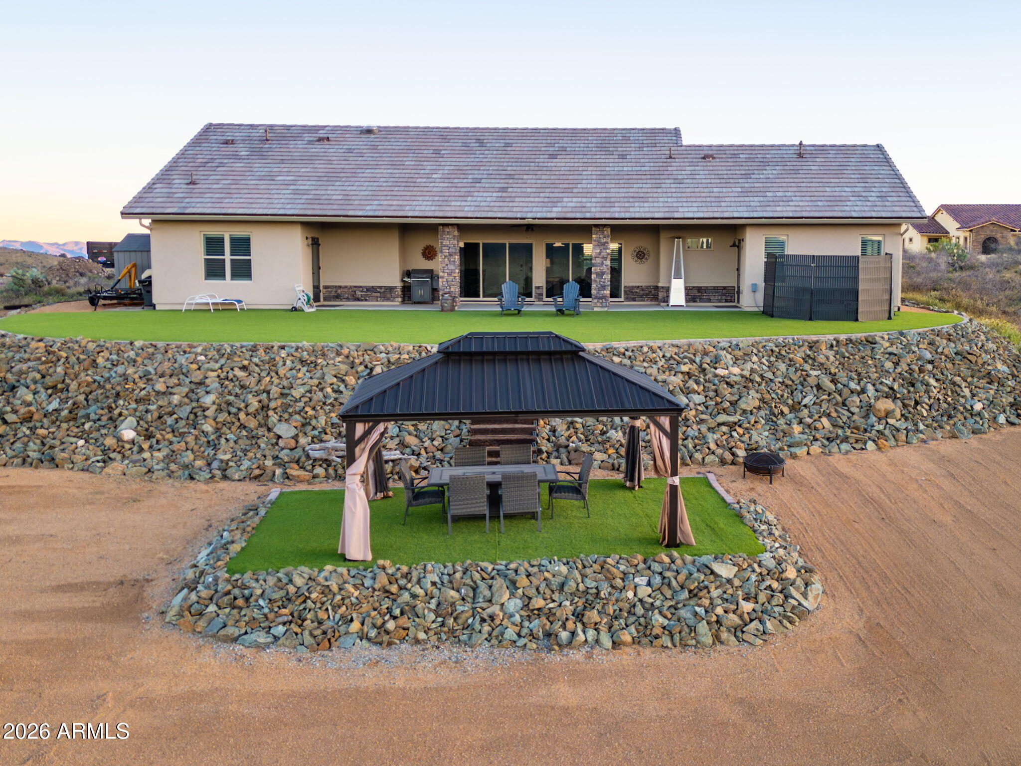 15140 East Countryside Road Mayer, AZ 86333 - Photo 44 of 67 a front view of a house with a garden