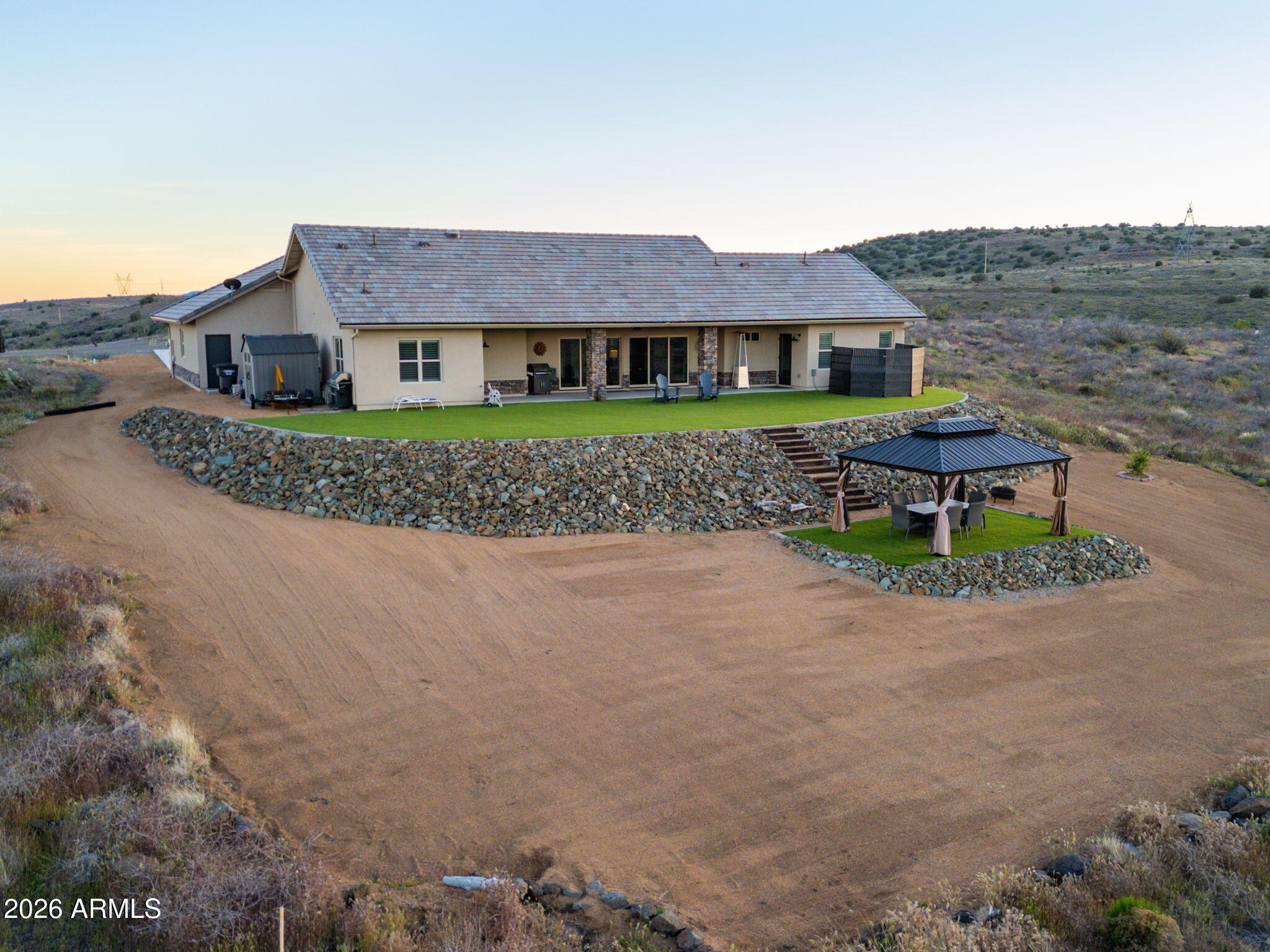 15140 East Countryside Road Mayer, AZ 86333 - Photo 46 of 67 a front view of a house with a garden