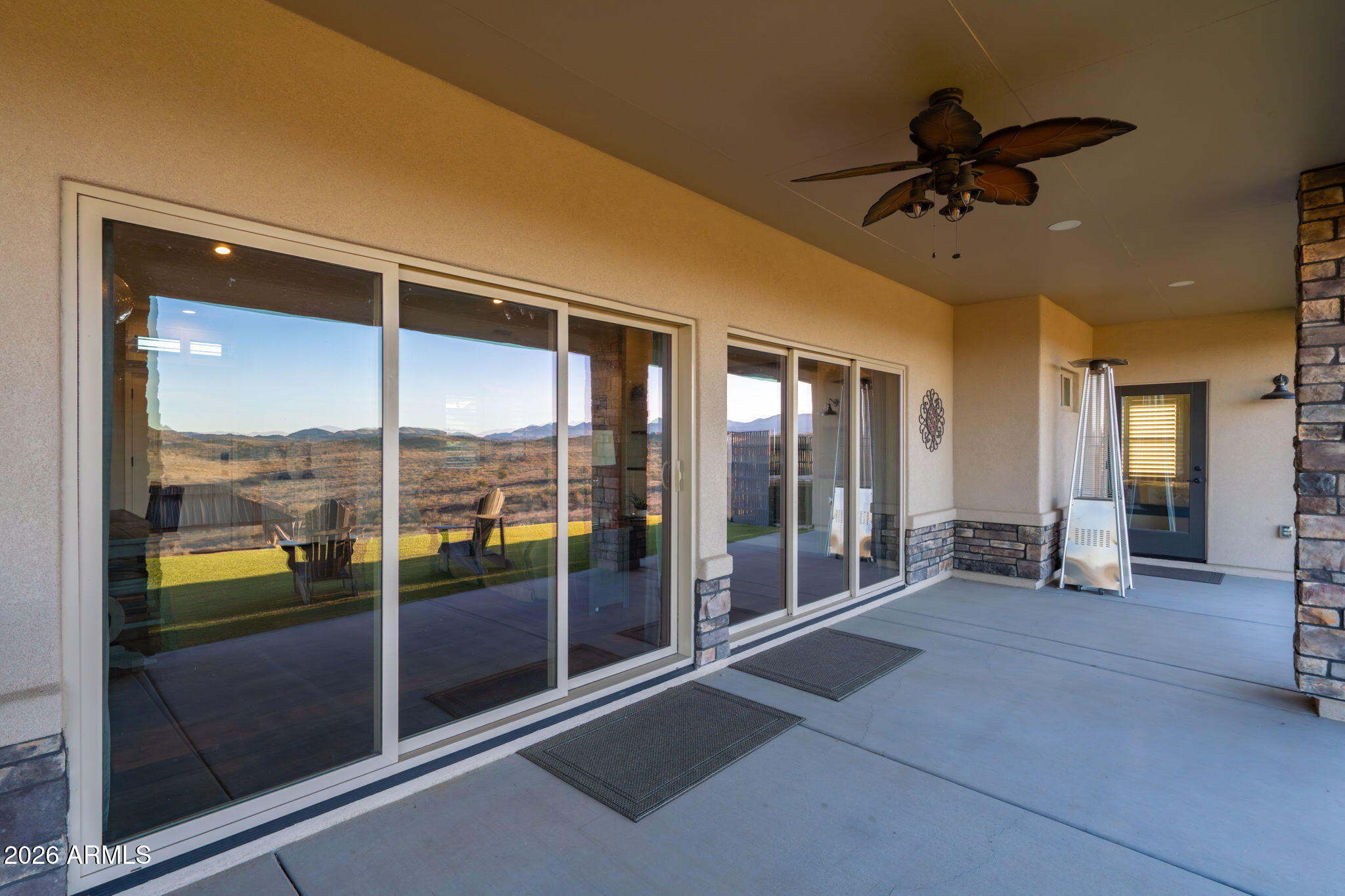 15140 East Countryside Road Mayer, AZ 86333 - Photo 49 of 67 a view of a room with a ceiling fan and windows
