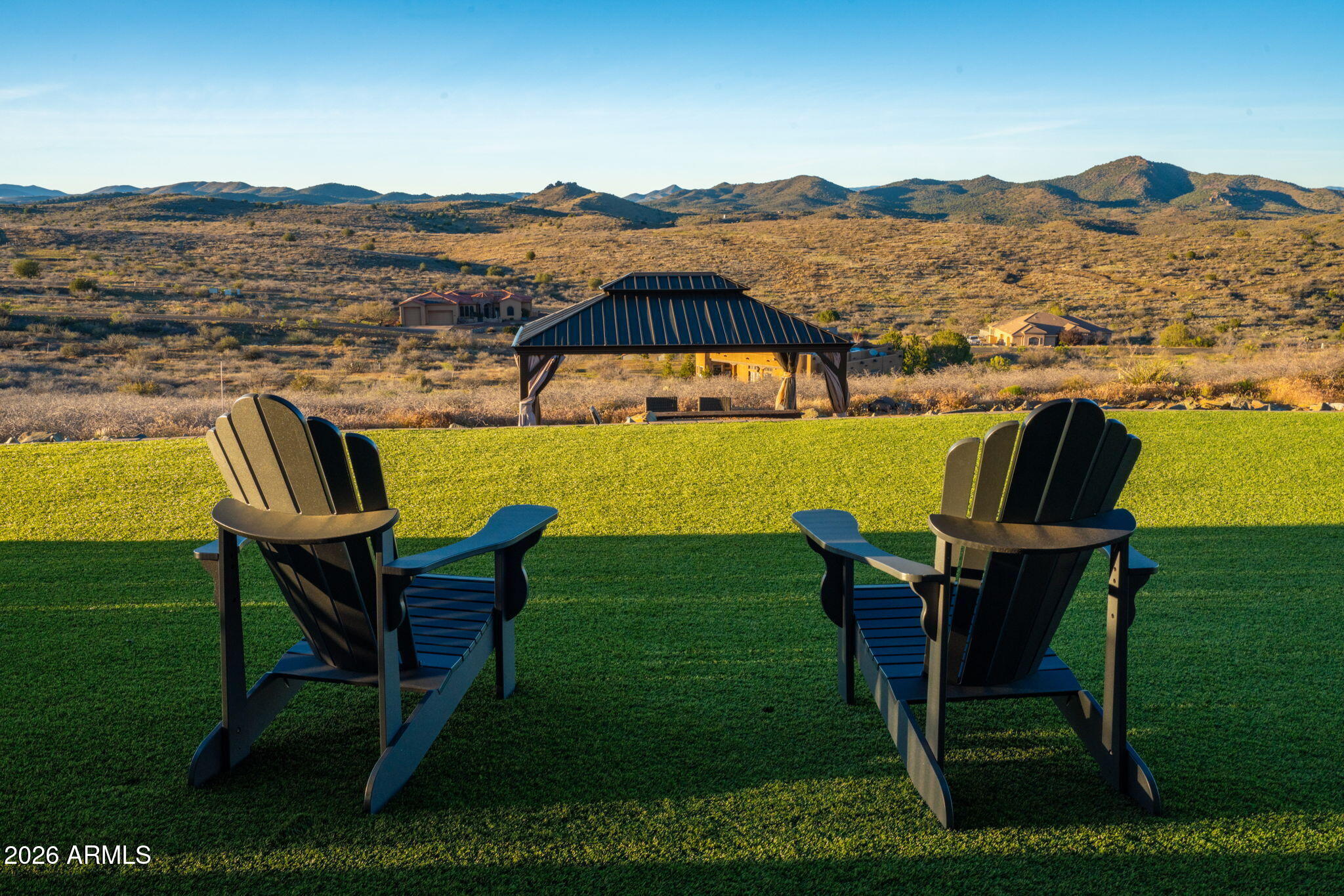 15140 East Countryside Road Mayer, AZ 86333 - Photo 50 of 67 a view of a chairs and table in patio with a lake view