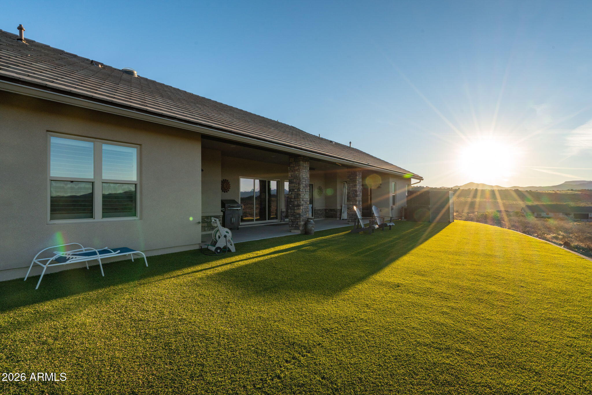 15140 East Countryside Road Mayer, AZ 86333 - Photo 52 of 67 a view of swimming pool with lawn chairs and plants