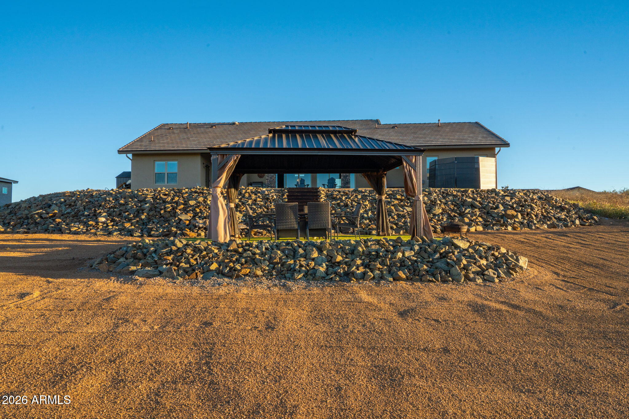 15140 East Countryside Road Mayer, AZ 86333 - Photo 57 of 67 a view of a wooden house with a yard