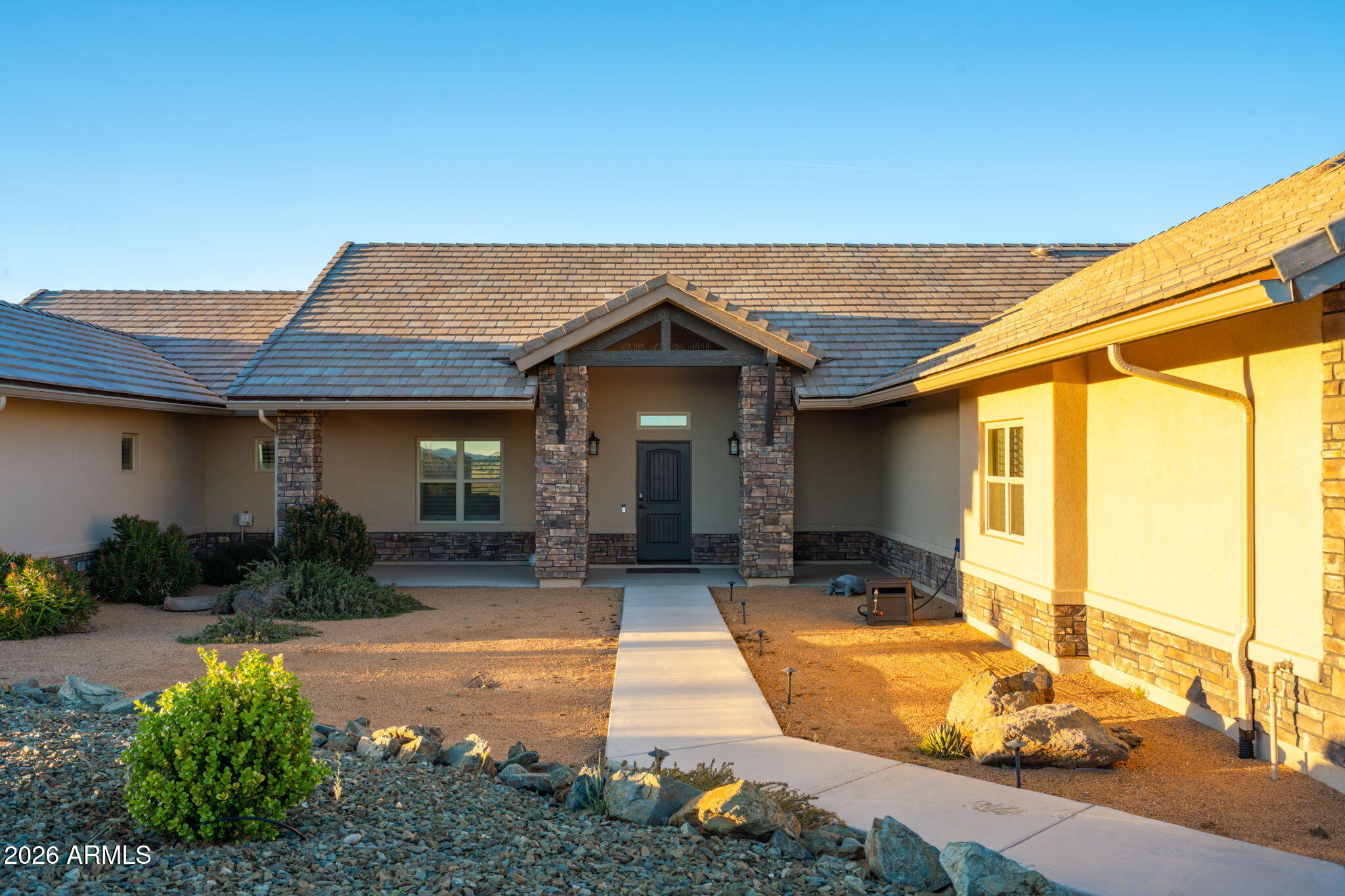 15140 East Countryside Road Mayer, AZ 86333 - Photo 6 of 67 a front view of a house with garden