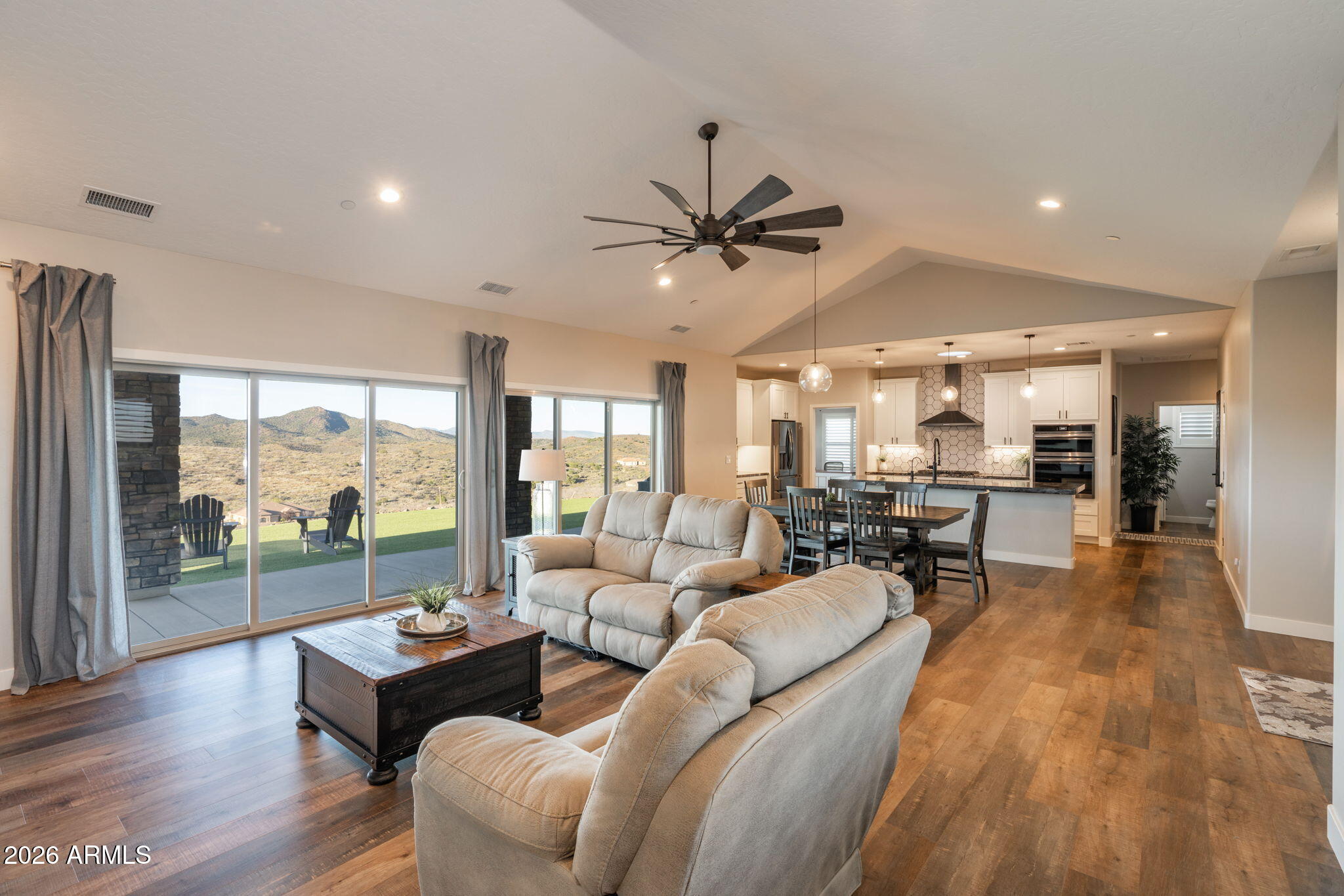 15140 East Countryside Road Mayer, AZ 86333 - Photo 9 of 67 a living room with furniture and a large window